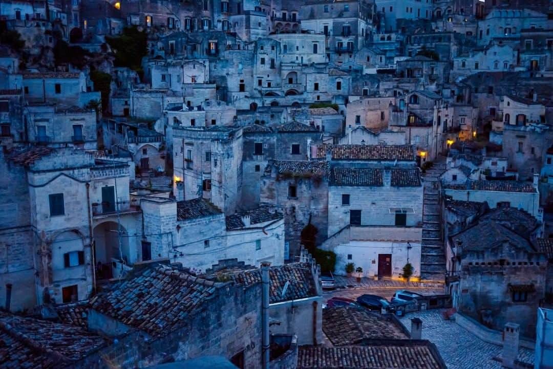 National Geographic Travelさんのインスタグラム写真 - (National Geographic TravelInstagram)「Photo by @francescolastrucci  A view of the Sassi at night in Matera, Italy. Matera’s core is the Sassi, hundreds of caves once used as dwellings and now on the UNESCO World Heritage List. They hold evidence of human settlements starting from the Paleolithic period and without interruption to the present day. More recently, after a period of decline, adventurous artists began moving back, and the recent history of the Sassi is precisely that of an awakening. Caves began being restored and turned into more comfortable houses, unique hotels, restaurants, and galleries. The city came back to life to the point that it was awarded the title of European Capital of Culture in 2019. Follow me @francescolastrucci for more places, daily life, and stories around the world. #matera #italy #dailylife」8月4日 9時10分 - natgeotravel