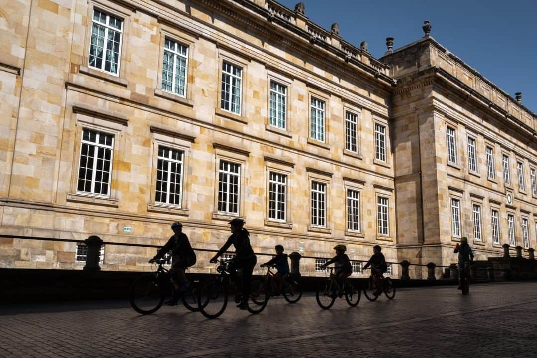 National Geographic Travelさんのインスタグラム写真 - (National Geographic TravelInstagram)「Photo by @juancristobalcobo  Cyclists ride through the historical section of Bogotá, Colombia, next to the Congress building. Every Sunday starting at seven in the morning, thousands of people claim the streets of this city’s main avenues and highways, replacing cars for bicycles, skates, scooters, or just plain walking. The event dates back to 1976 when a group of citizens concerned about the lack of public space for sports practice demanded that the city close stretches of roads usually filled with cars and buses. The experiment, called Ciclovía or Bikeway, continues to grow and has become one of the main attractions of this city, which is usually choked by impossible traffic. #bogota #colombia #bicycles」8月4日 21時07分 - natgeotravel