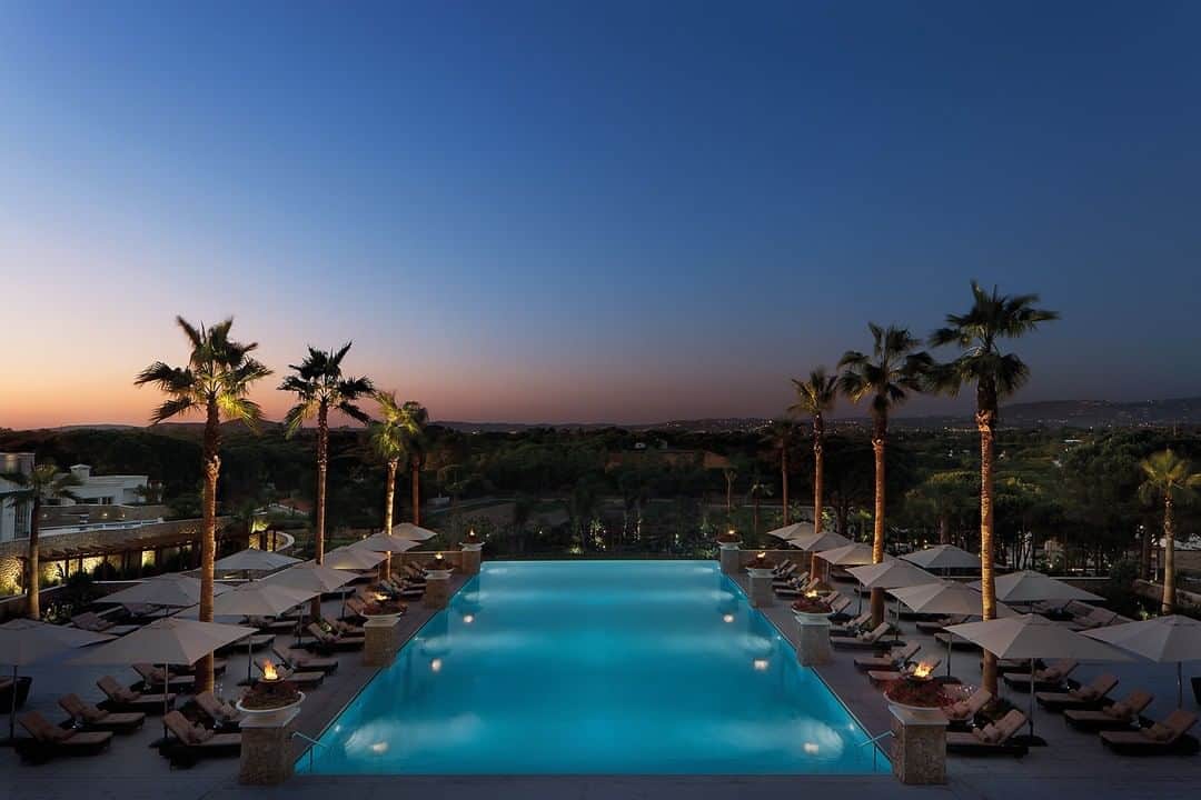 Conrad Hotelsのインスタグラム：「When the sun sets at the Conrad Algarve, let the torch-lit infinity pool be your backdrop for a night of Portuguese adventure」