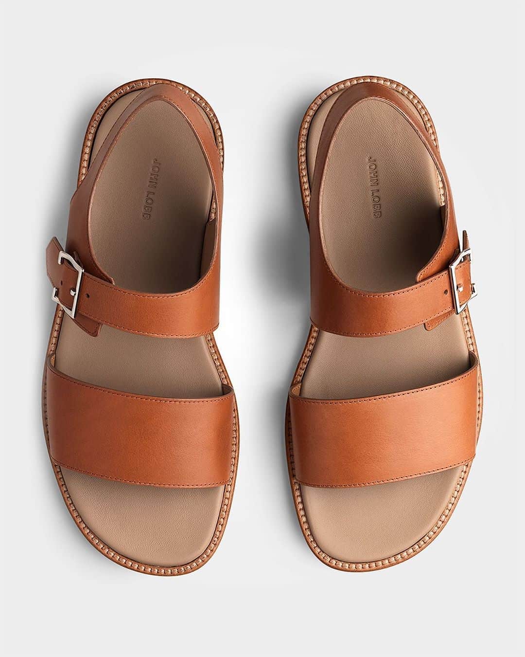 ジョンロブのインスタグラム：「Summer-ready with Stratton, a single buckle sandal featuring a strap across the toes instep, expertly constructed in either leather or rubber soles. . #johnlobb」
