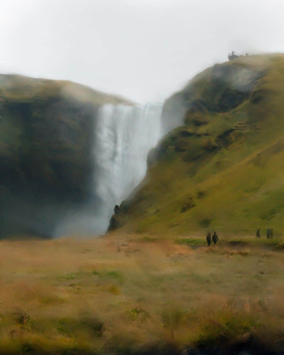 thephotosocietyさんのインスタグラム写真 - (thephotosocietyInstagram)「Photo by @MichaelGeorge // I don’t mind being wet, but many cameras do. On my last day in Iceland I found myself running late in my journey back to Reykjavík. Torrential rain made the driving slow going, and all the rags I’d kept to the side to dry my equipment were all soaked through. When the 40mph winds blew more sideways rain into my lens, I tried wiping it down, and found myself just smearing the water in circles. My last stop was Skógafoss waterfall, and I gave up on drying things off. As you can see, I did myself a favor. The last few images from my trip are a ‘through the looking glass’ blur of my final moments in this beautiful place. For more photos and writing from my travels, follow along @MichaelGeorge. // #skogafoss #waterfall #wetlens #iceland #visiticeland #isitblurryorisitart」8月6日 4時48分 - thephotosociety