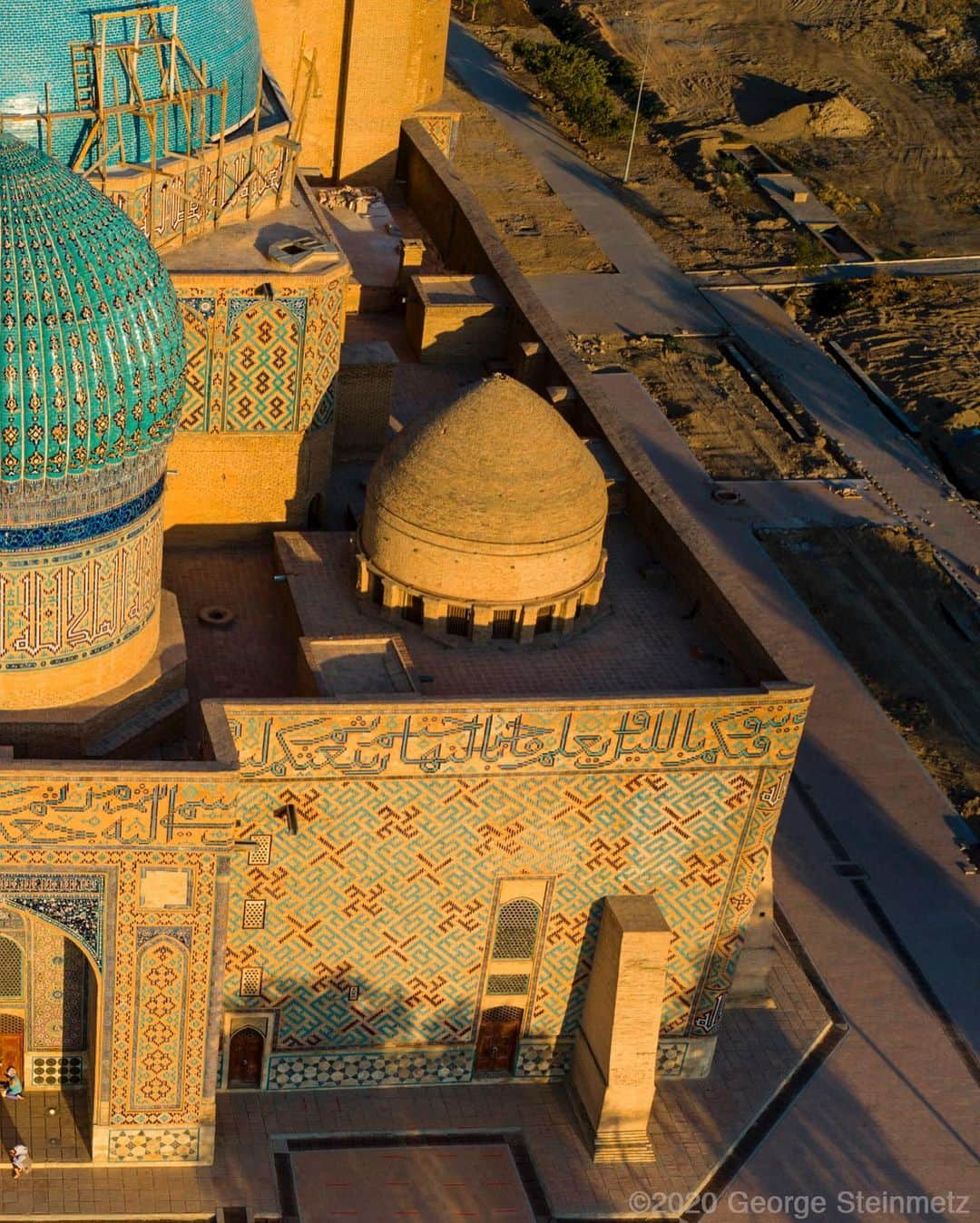 ナショナルジオグラフィックさんのインスタグラム写真 - (ナショナルジオグラフィックInstagram)「Photo by George Steinmetz @geosteinmetz  The 14th-century ceramic masterpiece of Turkistan, in Kazakhstan, still attracts pilgrims to this ancient town on the Silk Road. It was started by Tamerlane as a way to unify his people and show respect for the religious mystic Ahmad Yasawi. It was the grandest and most innovative building in Central Asia in its time, but only the backside, seen here, was finished before Tamerlane’s death. To  explore more of our world from above, follow @geosteinmetz.」8月7日 9時34分 - natgeo