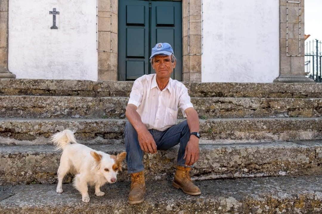 National Geographic Travelさんのインスタグラム写真 - (National Geographic TravelInstagram)「Photo by @KristaRossow  Last summer, while traveling on a Douro River cruise, I visited some tiny Portuguese villages where life is lived at a much slower pace. I met this man and his dog in Provesende as he was passing time in front of a church, trying to stay cool in the shade on a hot summer day. To see more images from my travels, follow me @KristaRossow. #Portugal #Douro」8月7日 21時07分 - natgeotravel