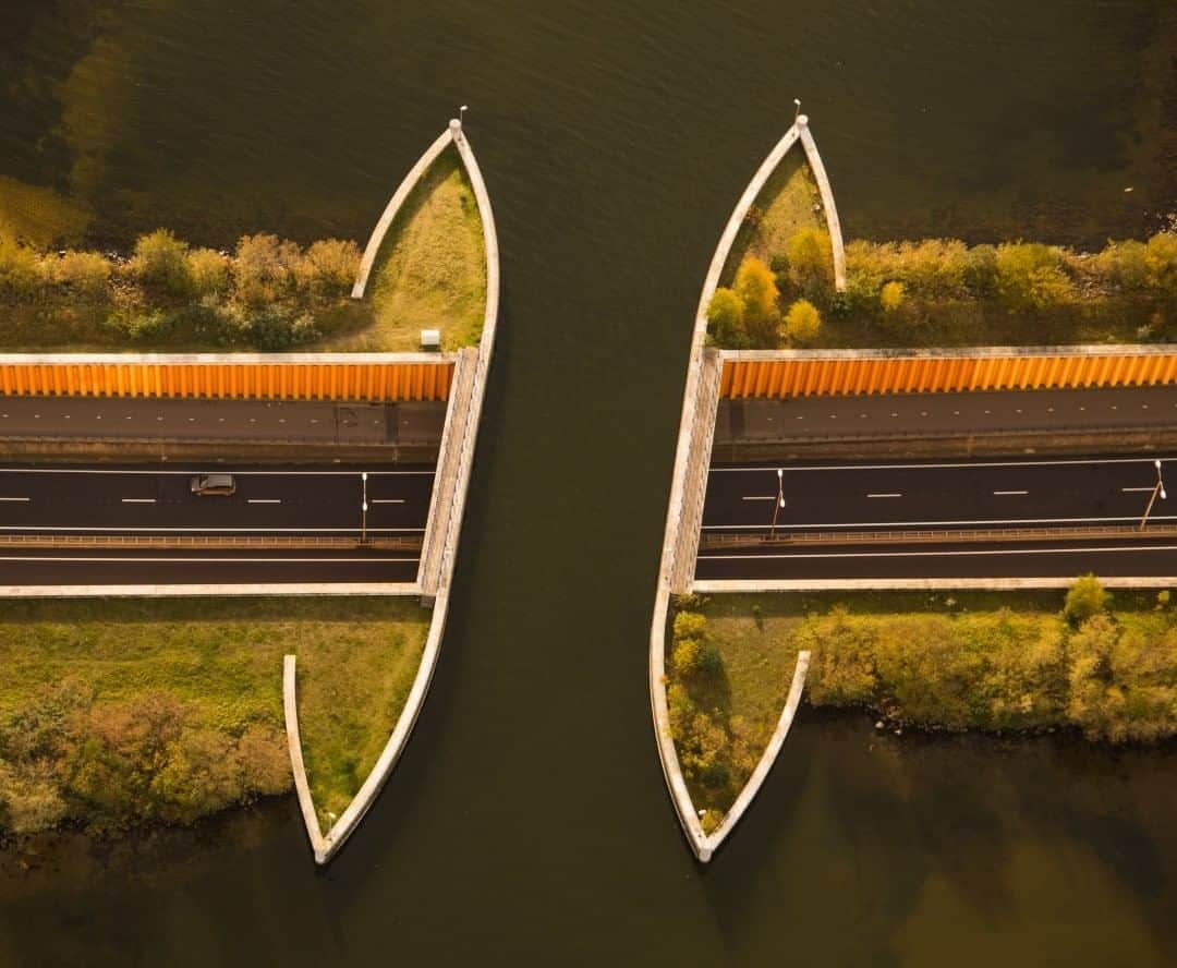 National Geographic Travelさんのインスタグラム写真 - (National Geographic TravelInstagram)「Photo by Aya Okawa @labyrinthiansmile  Echoes of Escher  With 26 percent of their land below sea level, the Dutch are experts at innovative water and flood management, using a series of canals, dams, channels, and many other methods. Flying over central Netherlands, I was fascinated by the patterns and geometric shapes in the human-altered landscapes throughout the region. This particular motorway passing beneath a canal caught my eye, reminding me of the perspective-bending work of the famous Dutch artist M.C. Escher.  Congratulations to Aya Okawa on becoming the July Your Shot Photographer of the Month! @natgeoyourshot #YourShotPhotographer」8月7日 23時02分 - natgeotravel