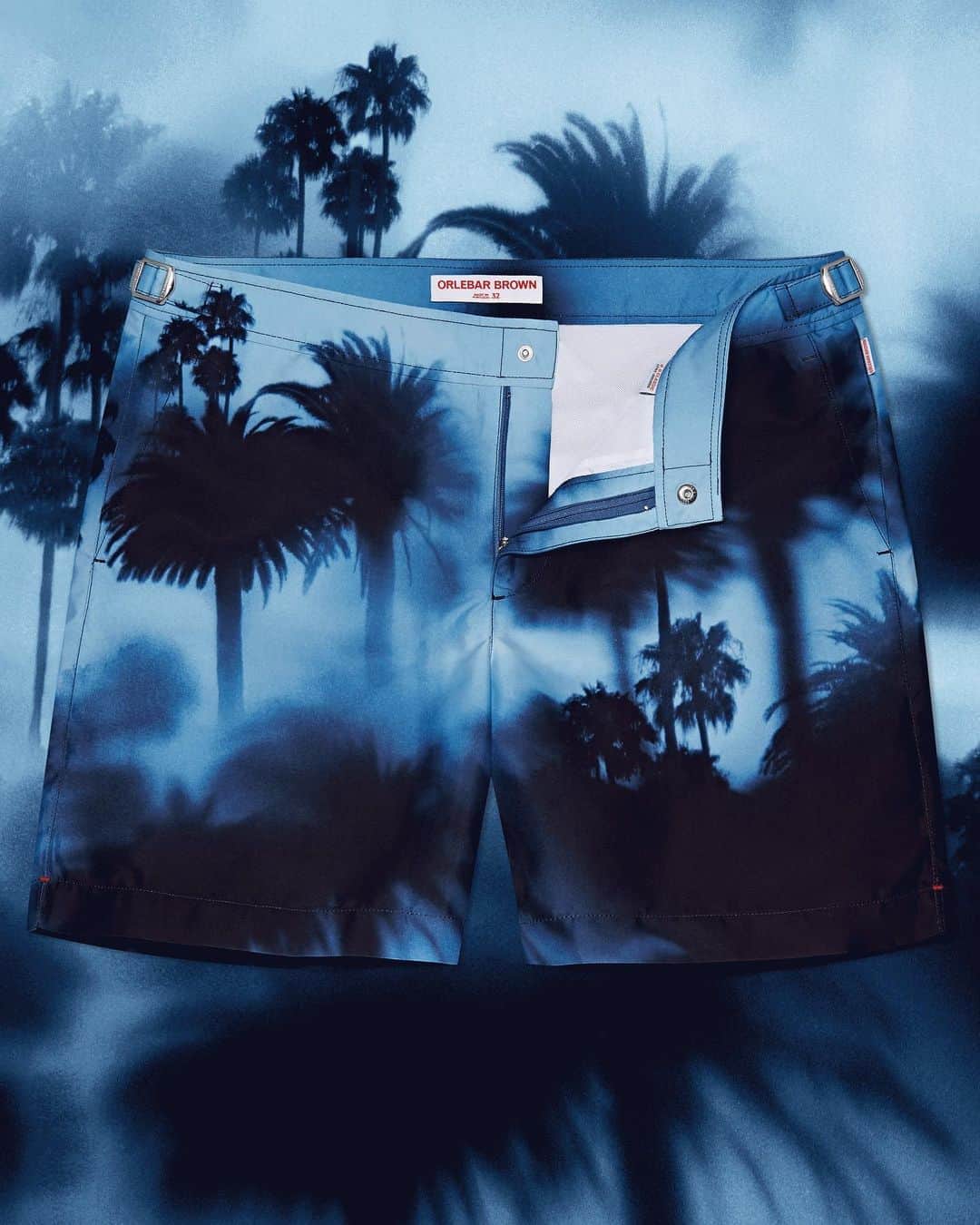 オールバーブラウンのインスタグラム：「The atmospheric palm trees printed on these Bulldog swim shorts were captured on film in Los Angeles by NYC-based artist Robert @Malmberg. This striking print is the ultimate conversation starter when you are lounging poolside, especially given the name of the swim shorts 'Tropic Like It's Hot'. 🔥🌴 Tap to shop.  #DoseOfSun #OrlebarBrown #OBsAroundTheWorld」