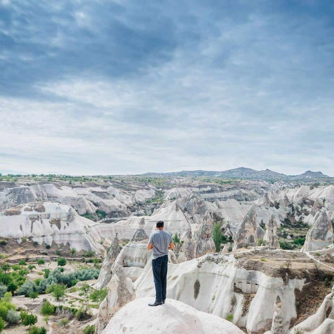 National Geographic Travelさんのインスタグラム写真 - (National Geographic TravelInstagram)「Photo by @junmichaelpark  A traveler marvels at the jagged, rocky hills of Cappadocia, Turkey. Some 30 million years ago, eruptions from nearby volcanoes covered the area with ash and mud. Since then erosion has shaped the curious-looking valleys and chimney-like rocks. Cappadocia is frequently featured as a backdrop for movies and TV shows. View more photos and stories from around the world @junmichaelpark.」8月11日 17時08分 - natgeotravel