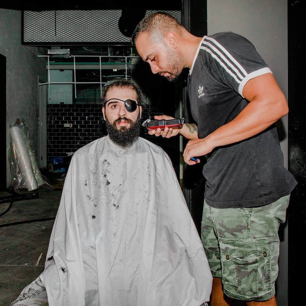 TIME Magazineさんのインスタグラム写真 - (TIME MagazineInstagram)「Kevin Obeid cuts Jad Estephan’s hair in the Mar Mikhael area of Beirut on Aug. 7, three days after the deadly port explosion in the Lebanese capital. "We have been living next to an atomic bomb for six years now. We stroll around, we walk by it, but we know nothing about it. How can the people in charge be this conscience-less?" asks Estephan, who lost his eye at the beginning of the revolution last year. "Let us hope that this catastrophe doesn't destroy us even further, but rather gives us a much needed strength. Because this is our last chance. We must change today, or never." Obeid says he went to Mar Mikhael that day for two reasons: "First, to help the people that lost their houses. As my family and myself have not been directly affected by the explosion, I consider it natural to help those that were affected. It is the least I can do. The second reason was that I wanted to use my skills to help people around me. I wanted to use my skills to fix them." Photograph by @myriamboulos for TIME」8月12日 2時50分 - time