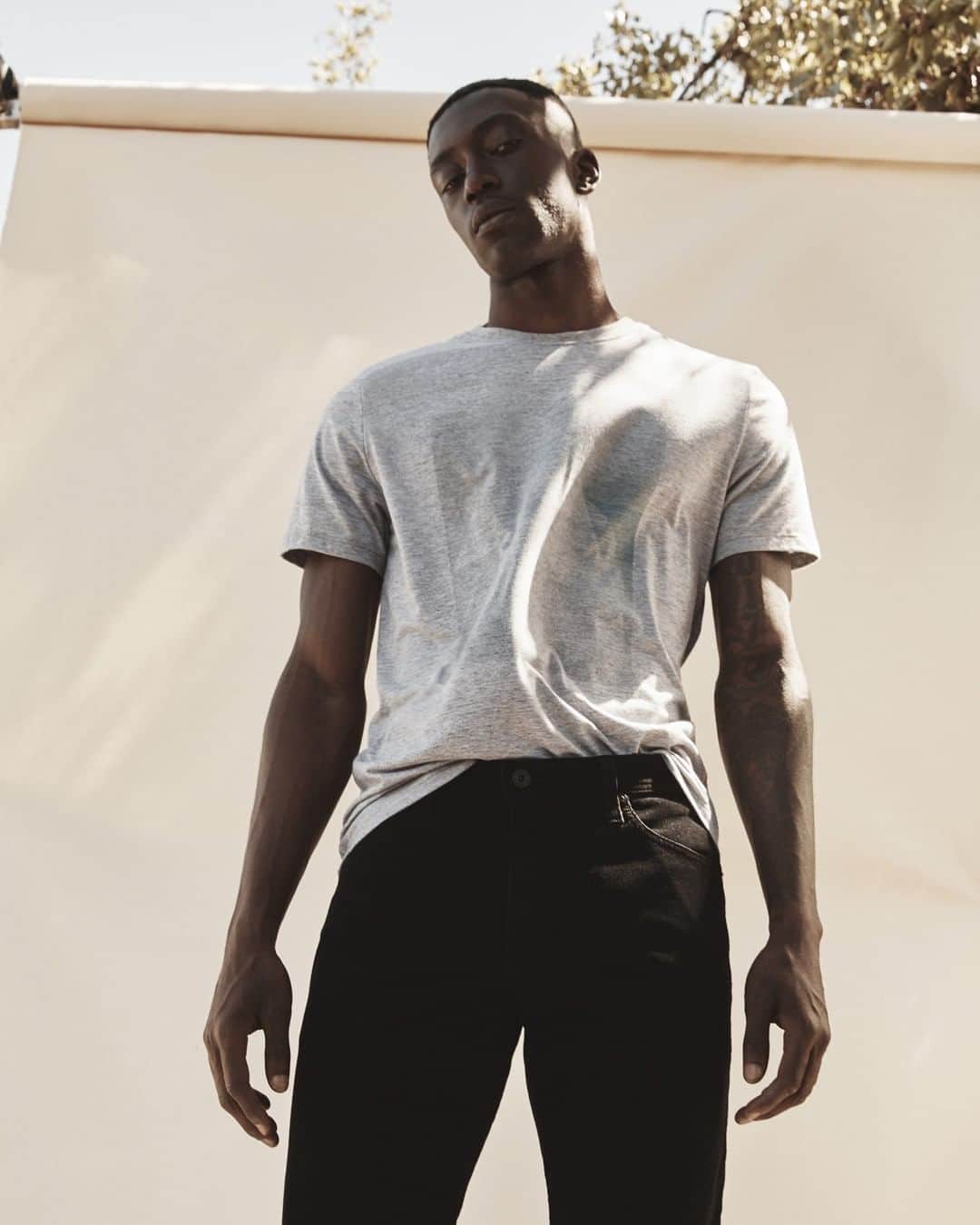 アドリアーノゴールドシュミットのインスタグラム：「The Bryce Crew Tee is a crewneck t-shirt featuring a vintage heathered grey with retro prism graphics at the front. Pairs well with the Graduate short. Link in bio to shop.」