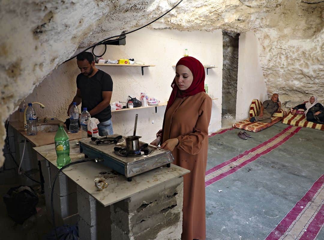 AFP通信さんのインスタグラム写真 - (AFP通信Instagram)「AFP Photo 📷 Jaafar Ashtiyeh - Palestinian family in cave home faces Israeli eviction -⁣ .⁣ Ahmed Amarneh's home, with a wooden door opening onto cushion-lined rooms, is not the first Palestinian residence in the occupied West Bank to receive a demolition notice from Israel.⁣ .⁣ But it may be the first built inside a cave which the Jewish state has threatened to destroy.⁣ .⁣ Amarneh, a 30-year-old civil engineer, lives with his family in the northern West Bank village of Farasin, where Israel insists it must approve any new residential construction and can tear down homes built without permits.」8月12日 13時06分 - afpphoto