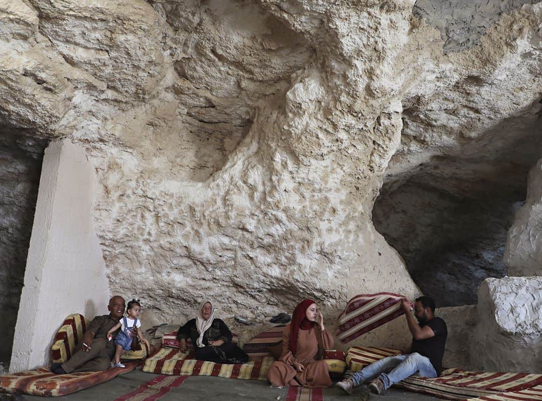 AFP通信さんのインスタグラム写真 - (AFP通信Instagram)「AFP Photo 📷 Jaafar Ashtiyeh - Palestinian family in cave home faces Israeli eviction -⁣ .⁣ Ahmed Amarneh's home, with a wooden door opening onto cushion-lined rooms, is not the first Palestinian residence in the occupied West Bank to receive a demolition notice from Israel.⁣ .⁣ But it may be the first built inside a cave which the Jewish state has threatened to destroy.⁣ .⁣ Amarneh, a 30-year-old civil engineer, lives with his family in the northern West Bank village of Farasin, where Israel insists it must approve any new residential construction and can tear down homes built without permits.」8月12日 13時06分 - afpphoto