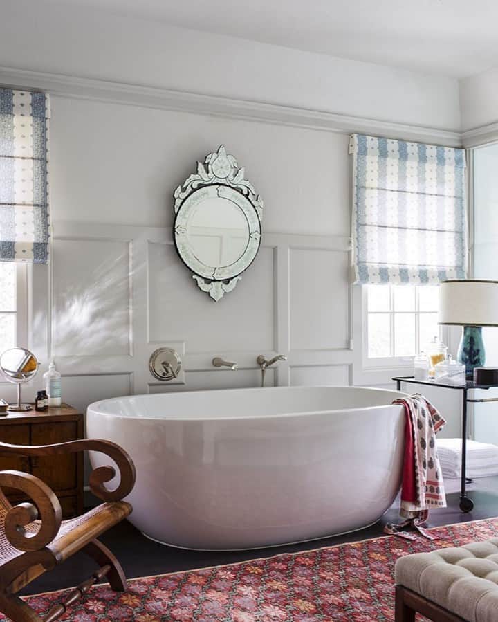 ELLE DECORさんのインスタグラム写真 - (ELLE DECORInstagram)「Actress Minnie Driver enlisted interior designer @peterdunhamdesign to transform her 1940s Hollywood Hills ranch into a home that fit her English Gypsy upbringing. The master bath features a Venetian mirror, a 1950s bar cart by Mathieu Matégot, a vintage rug, the flooring is oak and the walls are painted in @benjaminmoore's Navajo White. Click the link in bio for the full tour as seen in our April 2017 issue. Photography by @wabranowicz.」9月11日 7時00分 - elledecor