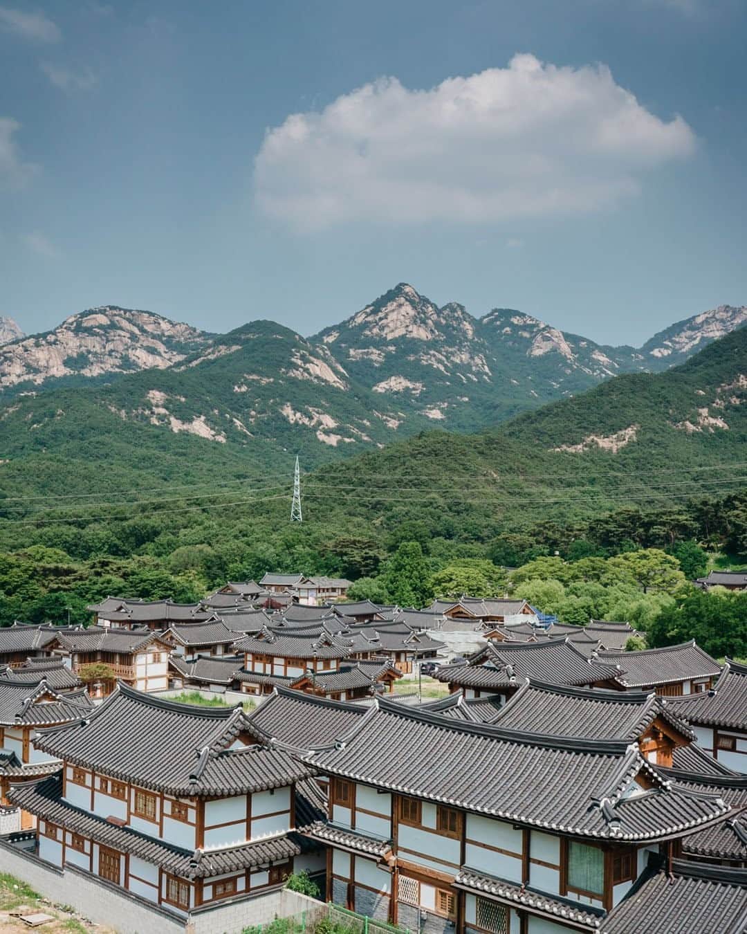 National Geographic Travelさんのインスタグラム写真 - (National Geographic TravelInstagram)「Photo by @junmichaelpark  Eunpyeong Hanok Village in northwestern Seoul is a planned hanok housing area. After decades of economic growth, apartment complexes have been associated with wealth and prestige in South Korea. However, the hanok—a traditional Korean house—is coming back into vogue. For more photos and stories, follow @junmichaelpark.」9月11日 9時05分 - natgeotravel