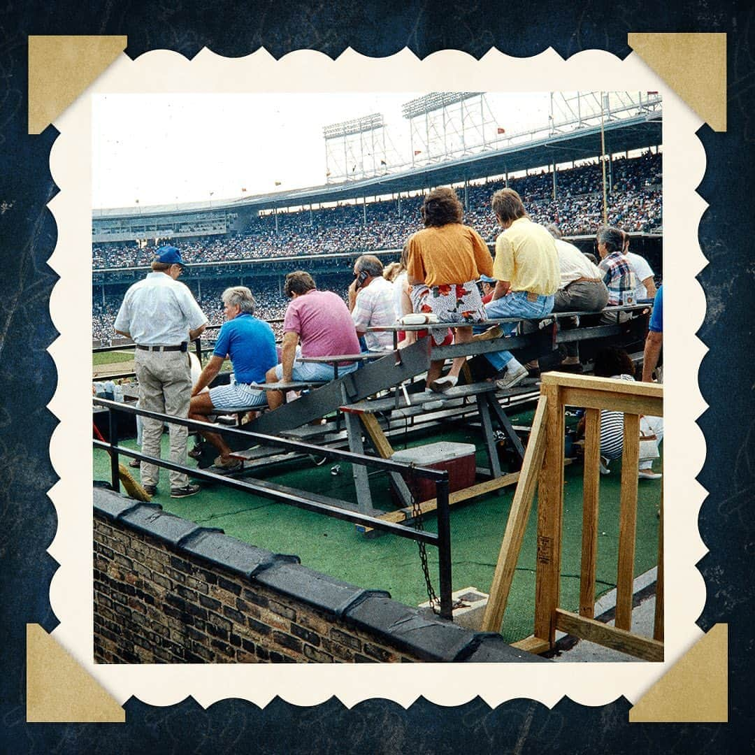 シカゴ・カブスさんのインスタグラム写真 - (シカゴ・カブスInstagram)「#CubsCollection: Rooftops. Waveland and Sheffield Avenues are home to some of the most unique seats in baseball. First time visitors to Wrigley Field often point at the stadium seats affixed to the rooftops across from the ballpark with amusement and awe. These buildings predate the ballpark for the most part, serving simply as apartment buildings for most of their existence. Tenants would often head to their rooftops to watch Cubs games. Eventually the rooftop seating became an extension of the historic ballpark, with each building selling tickets to enjoy Cubs baseball from its unique vantage point. Some fans have even grown an affinity to buildings on Waveland and Sheffield the way some pick left or right field in the bleachers. The rooftops are an authentic Wrigleyville experience that cannot be replicated anywhere else. Even opposing players have tried to get in on the fun. In 1993, Reds pitcher Tom Browning was not scheduled to start. During the game he was caught by a television camera on one of the rooftops enjoying the game. The rooftops are currently one of very few ways baseball fans have been able to safely catch a game in-person during this unprecedented 60-game season. Have you ever watched a Cubs game from one of the rooftops around Wrigley Field?」9月9日 7時17分 - cubs