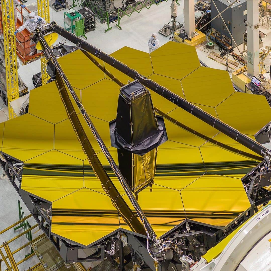 NASAさんのインスタグラム写真 - (NASAInstagram)「#WorldPhotographyDay 📸   We’re marking World Photography Day with a nod to @NASAWebb and their Goddard-based photographer, Chris Gunn.  Gunn has been creating art for NASA since 2000, and is currently documenting the creation of the James Webb Space Telescope, set to launch in 2021.  1. This image, shot in 2017, shows the Webb telescope sitting inside Chamber A at NASA's Johnson Space Center in Houston following cryogenic testing.   2. Here's a view from overhead of the Webb telescope's primary mirror, with its secondary mirror booms stowed. This is the position that the secondary mirror will be in during launch.   3. In this photo, the Webb telescope is hanging upside down so the lift crew can install a new rollover fixture.  4. This is a self-portrait of Gunn in a “bunny suit,” which is required when entering a clean room.   Photo credits: Chris Gunn/NASA」8月20日 3時13分 - nasagoddard