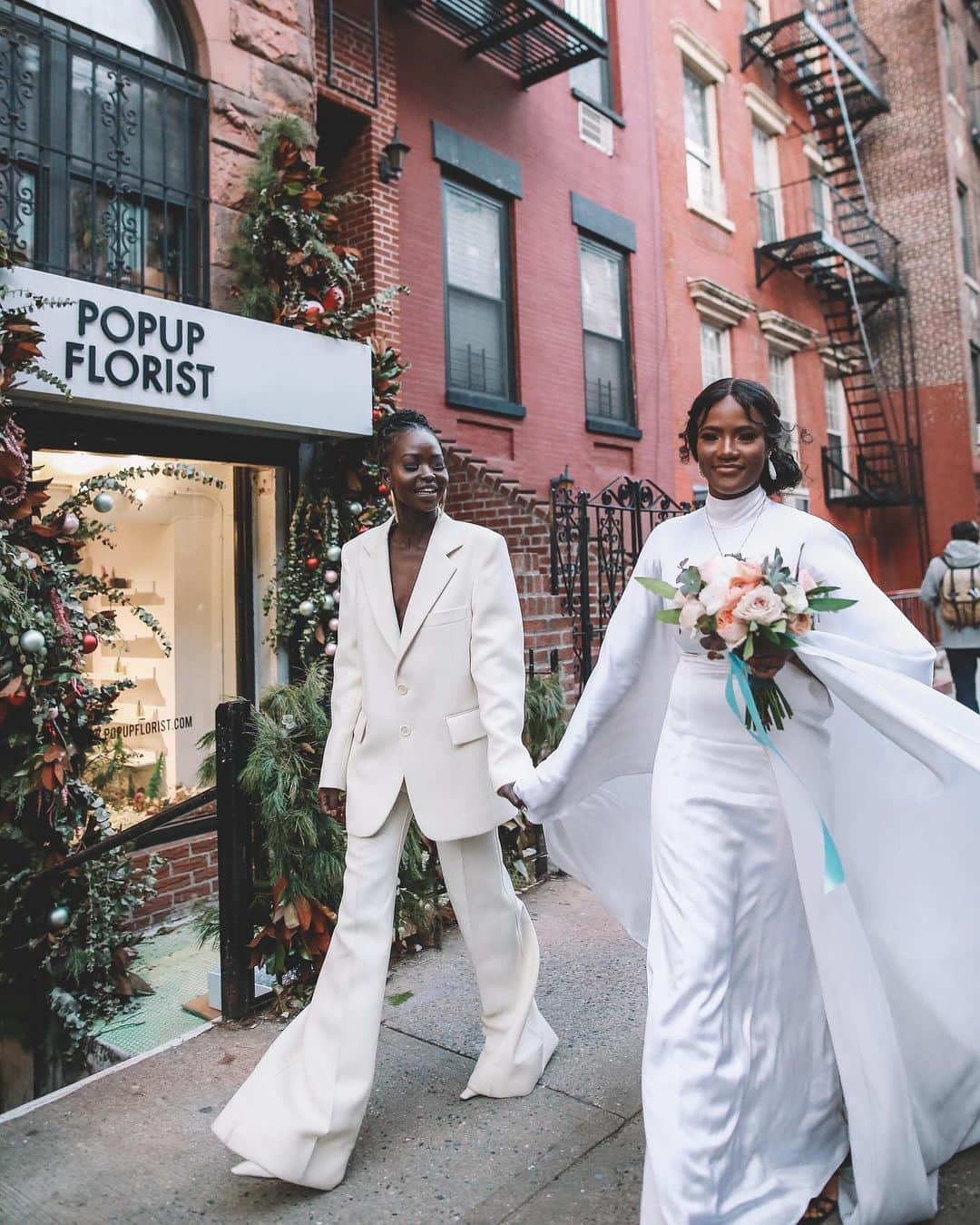 Vogue Australiaさんのインスタグラム写真 - (Vogue AustraliaInstagram)「Model @awengchuol and nail-artist entrepreneur @lexymayjust tied the knot at City Hall in Manhattan, New York, this past December. “During the ceremony, I felt at peace, as if all of the flights, the tears, and sweat leading up to the ceremony was beyond worth it,” Aweng says. After exchanging vows, the newlyweds went to get matching “XII” tattoos on their ring fingers in commemoration of the day, December 12. “What better way to end a NYC wedding than at a tattoo shop?” Alexus notes. Then, after getting inked, they were off to Penn Station to grab pizza. “She’s not a huge fan of pizza,” Aweng says. “But when she craves it, she would stop here as it’s always good!” Tap the link in our bio to go inside their New York City wedding. 📷 @photo_tatianakatkova」8月23日 8時21分 - vogueaustralia