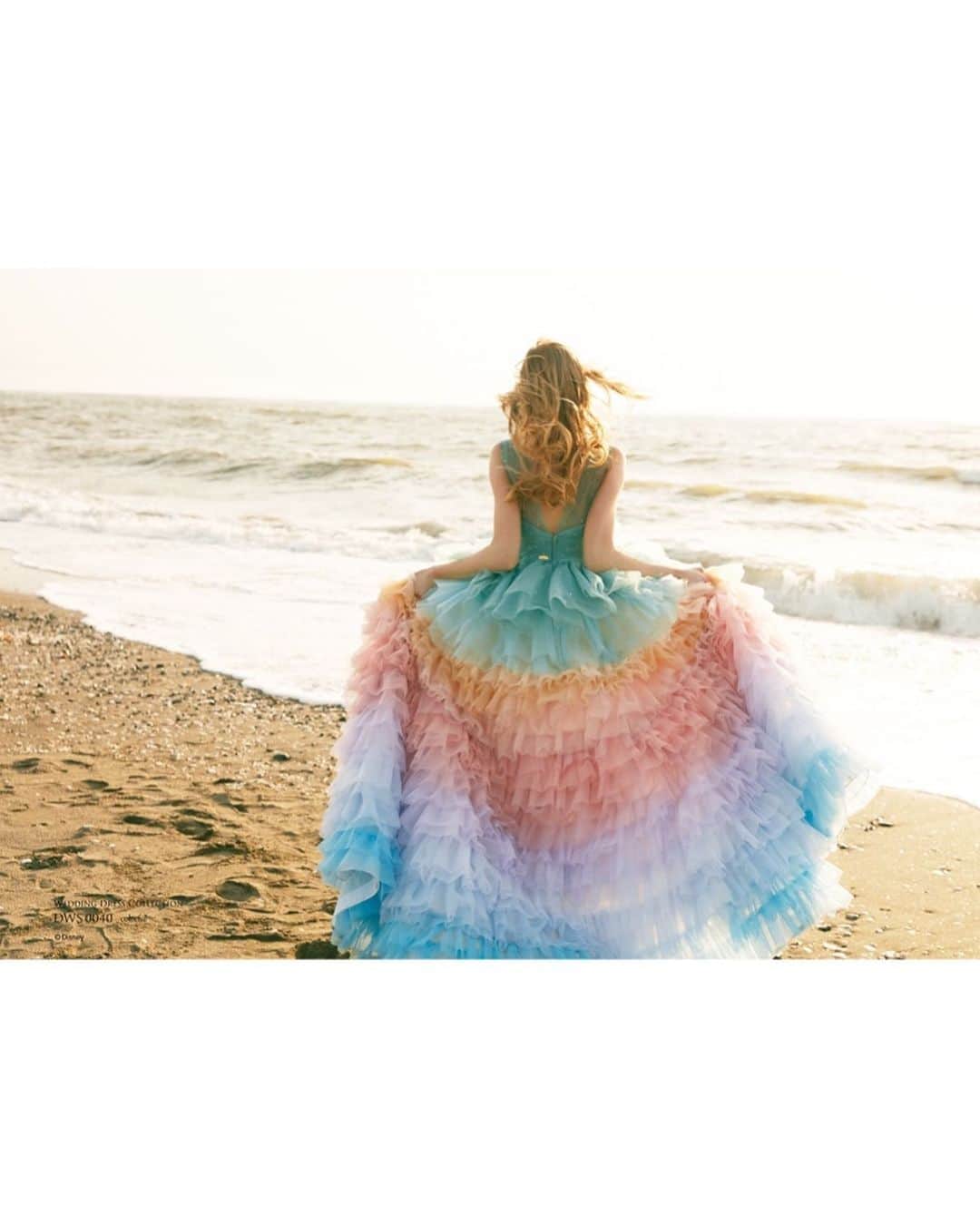 ACQUA　GRAZIE（アクア・グラツィエ）さんのインスタグラム写真 - (ACQUA　GRAZIE（アクア・グラツィエ）Instagram)「● DWS0040（colorful）﻿ アリエルをメインとした姉妹をイメージした虹色のドレス。﻿ 身頃に散りばめられた繊細なパールとオーロラのビーズは波や海の泡を﻿ 細かく重なったフリルはマーメイド達のヒレを表現。﻿ 姉妹達が彩る『リトル・マーメイド』の世界が詰まった一着。﻿ ﻿ �#アクアグラツィエ #ACQUAGRAZIE ﻿ #destinyline #デスティニーライン �#disney #disneyprincess #princess ﻿ #disney_weddingdresscollection  #weddingdress #dress  #colordress﻿ #ディズニー #ディズニー_ウエディングドレス﻿ コレクション #ディズニープリンセス #プリンセス ﻿ #カラードレス #アリエル #Ariel﻿ #リトルマーメイド #マーメイド #新作ドレス ﻿ #ウェディングドレス #ドレス﻿ #ディズニードレス #結婚式 #結婚﻿ #プレ花嫁 #卒花嫁 ﻿ #クラウディア #kuraudia﻿ ﻿ ディズニーオフィシャルホテルへの持ち込みは﻿ ご遠慮いただいております。﻿ ©Disney﻿」8月23日 19時00分 - acquagrazie