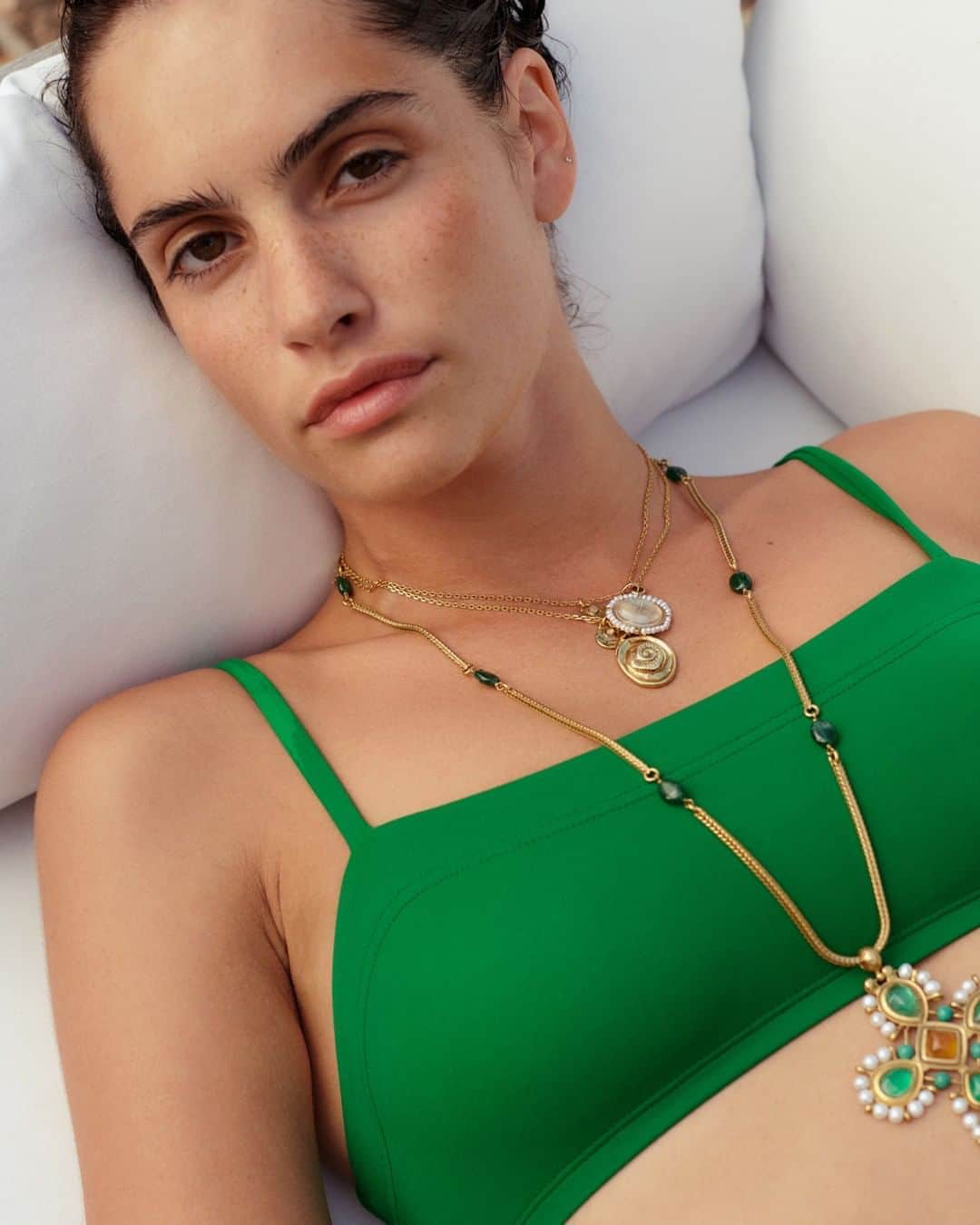 グーセンス パリのインスタグラム：「TALISMAN pendants and VENISE cross pendant adorned with tinted rock crystal cabochons, freshwater pearls and turquoise. . . @prunepauchet shot by @sashamarro and styled by @smala.paris」