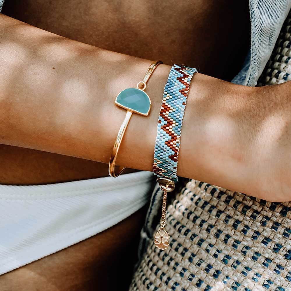 のインスタグラム：「Is your moon half full or half empty?⠀ ⠀ Mix and mismatch Azuni semi precious gemstone and beadwork jewellery for sophisticated, luxury artisan look.   Featured: Skylar half moon bangle in aqua chalcedony and Tolita narrow woven cuff.」