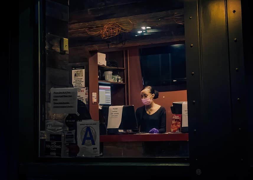 thephotosocietyさんのインスタグラム写真 - (thephotosocietyInstagram)「Photos by @dina_litovsky // I spent the three months of shelter-in-place photographing Manhattan after dark. The night offered a cinematic glimpse of the city plunged into one of its bleakest times. By losing its social purpose, the familiar landscape of the city’s bars, restaurants, intersections and squares, became unrecognizable. The empty streets transformed into a Hopperesque space of the ultimate night punctuated by lit windows and glowing streetlights. These few remaining sources of light offered a sanctuary against the alienating darkness, providing glimpses of domestic warmth and giving refuge to the lonely passersby, shuffling in and out darkness. Disoriented by the city I have called home for the last 20 years, I was reminded of a dystopian sci-fi film, Dark City, where a dreamlike metropolis is trapped in eternal nightfall. New York City has since returned to a semblance of normalcy, and those few weeks already seem to be a vision of another world. For more images, follow me @dina_litovsky. #darkcity2020」8月26日 10時18分 - thephotosociety