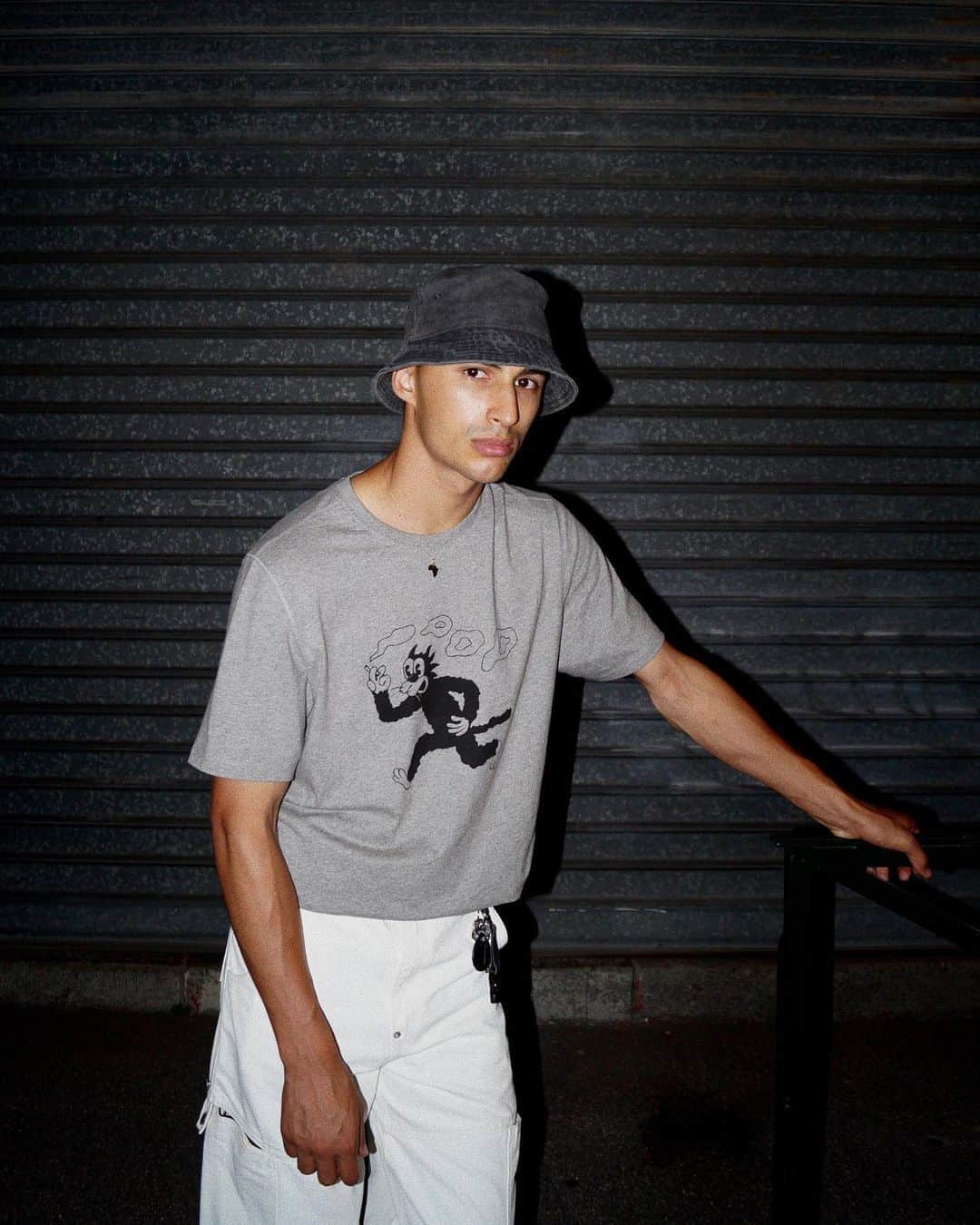 MR PORTERのインスタグラム：「Malvin The Cat smokes but he doesn’t — Mr @sickwan wearing a @poptradingcompany exclusive from the MR PORTER Tee Store. Head to the link in bio or tap to shop. #MRPORTERTeeStore  🛒 Pop Trading Company - + Malvin The Cat Printed Mélange Cotton-Jersey T-Shirt」