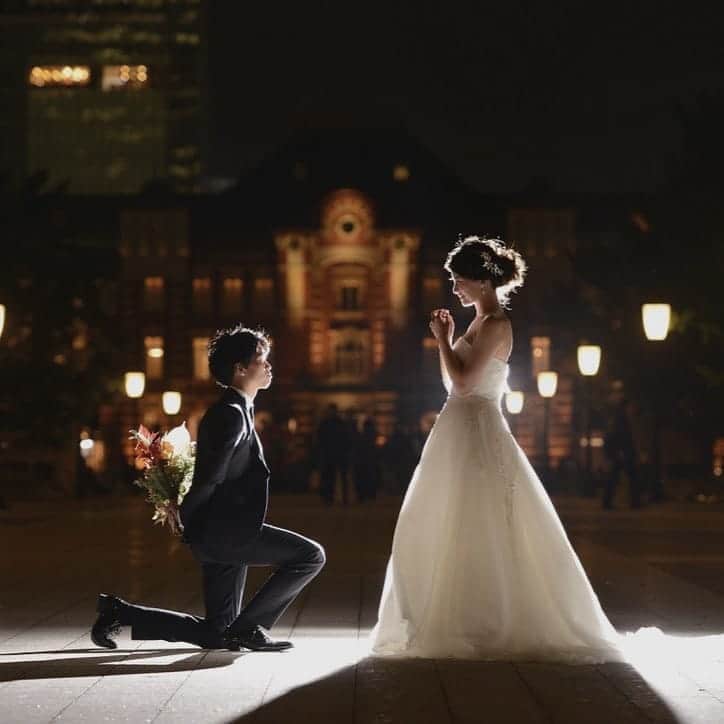 St.AQUA 東京の結婚式場 サンアクアチャペルのインスタグラム：「〜location photo TOKYO STATION〜  ロマンチックなロケーションフォト。 夜景にきらめく、ドレスと東京駅。 幻想的な1枚をお残しいただけます。  #結婚式 #wedding #ウェディングフォト #ロケーションフォト #シンデレラフォト #東京駅前撮り #丸の内前撮り #tokyostation #結婚式準備 #花嫁準備 #結婚式場探し #プレ花嫁 #日本中の花嫁さんと繋がりたい #おしゃれ花嫁 #ゼクシィ #2020年冬婚 #2021年春婚」