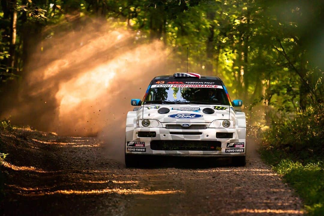 ケン・ブロックさんのインスタグラム写真 - (ケン・ブロックInstagram)「Even though the bulk of the race stages were at night for the Southern Ohio Forest Rally, the testing and practice sessions offered up some rad opportunities for daylight photos of my Ford Escort RS Cossie V2 at speed on the gravel. It also offered an opportunity to put @mister_zachary into the co-driver seat to see how well he could read pace notes at speed on the gravel through the forest. You’re going to have to click the link in my bio to see that. Check it out! #gravelmachinegun #FordEscort #CossieWorldTour #BlockEscortCossieV2」8月28日 3時21分 - kblock43