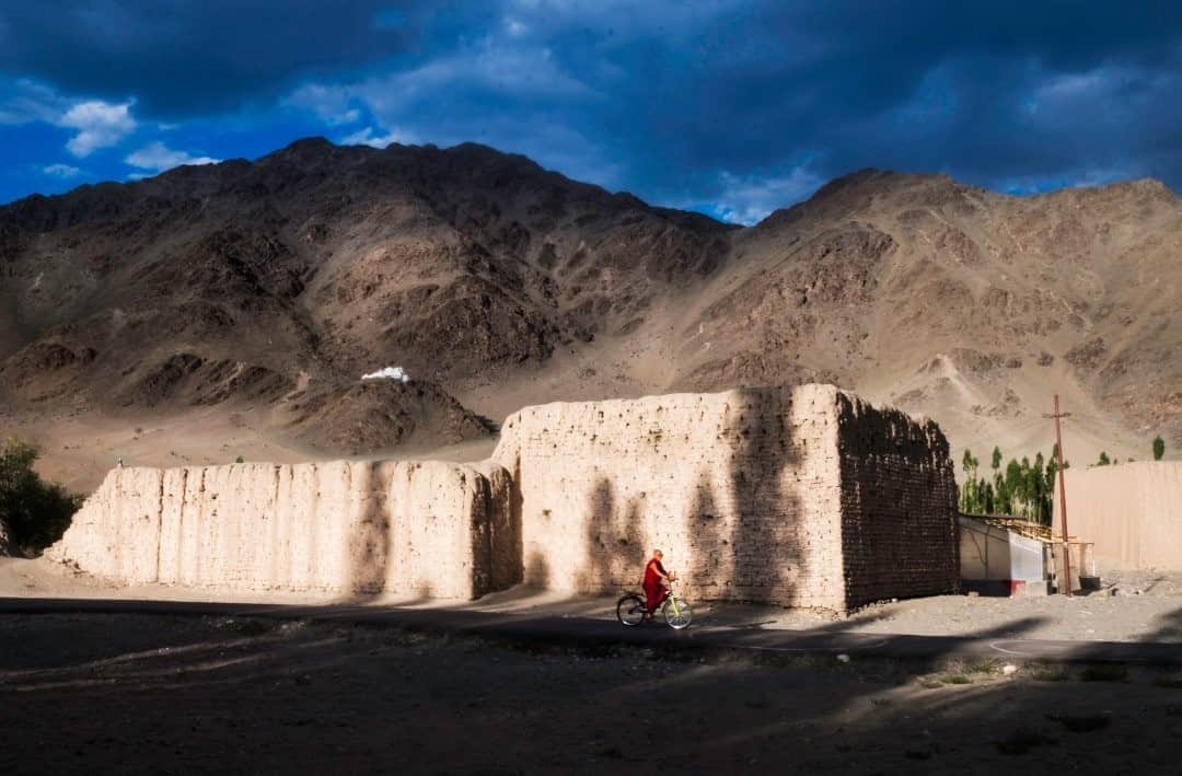 National Geographic Travelさんのインスタグラム写真 - (National Geographic TravelInstagram)「Photo by @deeptiasthana  Chamba Lamo, a Buddhist nun, practices riding a bicycle in Ladakh, part of the western Himalaya in northern India. Buddhism spread in India in the second century. Most people in eastern Ladakh and western Tibet were practicing the Bon religion at the time. Eventually Buddhism spread all over Ladakh, and the Buddha's teachings have been well preserved by the populace. Ladakh now has a total of 28 nunneries.  One of those nunneries is in Nyerma village, just eight kilometers (five miles) away from Leh town, the capital city of Ladakh. The nunnery allows visitors to live, eat, and pray with the nuns. The nuns grow their own food in the organic garden, which they share with their guests. This not only allows young nuns to interact with Indian and international guests, but it also provides an opportunity to learn different arts and crafts from the visitors.」8月28日 13時09分 - natgeotravel