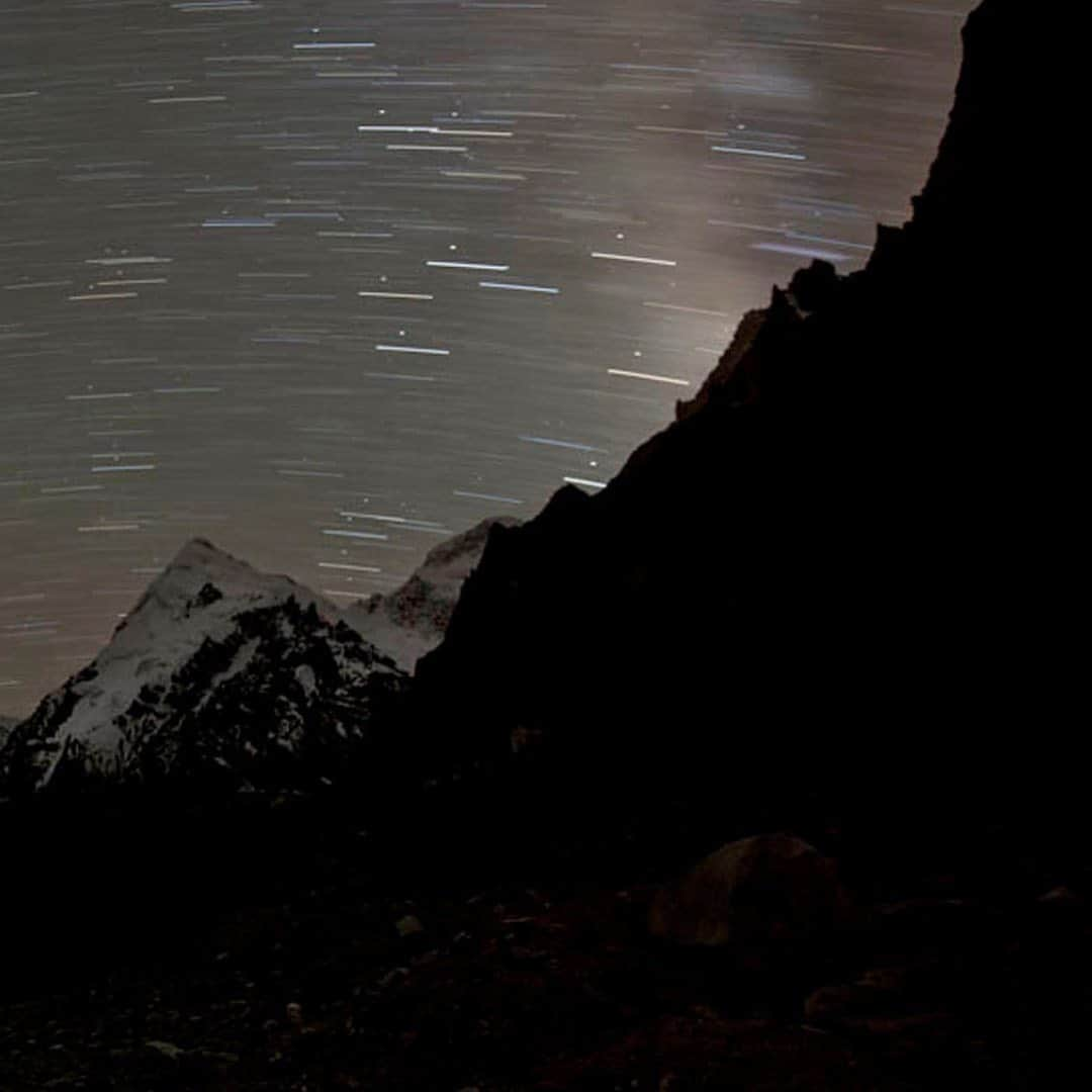 thephotosocietyさんのインスタグラム写真 - (thephotosocietyInstagram)「Photo by @tommy.heinrich / Words by @chipbrownnyc  A tiny pinprick of light emanates from the tent of the successful summit team (on the peak at center left) signaling their return to the bivouac site at 8,300 meters after 15 hours of climbing.  On assignment @natgeo and as a team member of the expedition led by Ralf Dujmovits, on August 23rd 2011 Gerlinde Kaltenbrunner, Maxut Zhumayev and Vassily Pivtstov reached the summit of K2 and completed the ascent of all 8000 meter mountains without oxygen, together with Darek Zaluski who stood on his 5th 8000er. Hours before making this picture, eager to reach the top, focused on photographing, climbing with a heavy load, I realized there was no room for error when swept and buried under the avalanches. Perhaps one of the hardest decisions I faced was to turn back during our final summit push. While on assignment @natgeo I felt committed to return with great images rather than reaching the top. This 14 minute exposure was made from Advanced Base Camp, more than two miles away. And I still wish I had been with my teammates on the summit that day, I still wish I was part of that light glowing with the stars….  But I would Not have captured this moment that sums why we climb.   We were one…. as a team….   We were one…. with the mountain.    @natgeo  @thephotosociety  @nikonargentinaoficial  #xinjiang #k2northface  #k2 #mountaineering  #expeditions  #climbing  #motivation  #inspiration  #teamwork  #conferencias  #motivacion  #inspiracion」8月29日 11時56分 - thephotosociety