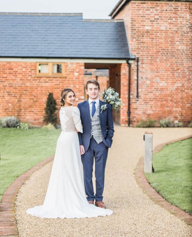 ミナのインスタグラム：「Harlow dress has the prettiest details at the back and on the sleeves. They are created by cutting out lace motifs and then rearranging them to create a triangular pattern.⁠ ⁠ Venue: @aptonhall ⁠ Photography: @laurajanephotographer ⁠ Stylist: @partysquared_weddings ⁠ Videography: @purseyproductions ⁠ Flowers: @stockflorist ⁠ Makeup: @katiepoole_mua ⁠ Hair: @bridalhairbyjennie ⁠ Cake: @thehoneybeeweddingcakeco ⁠ Stationery: @leigh_calligraphy ⁠ Veil: @sashandveil ⁠ Rings: @smokeandashjewellery ⁠ Hair pieces: @heyjulesbridal ⁠ Suits and shoes: @dapperchapsformalwear ⁠ Models: @sophierajah_ and @_jackryanpage_ ⁠ ⁠ ⁠」