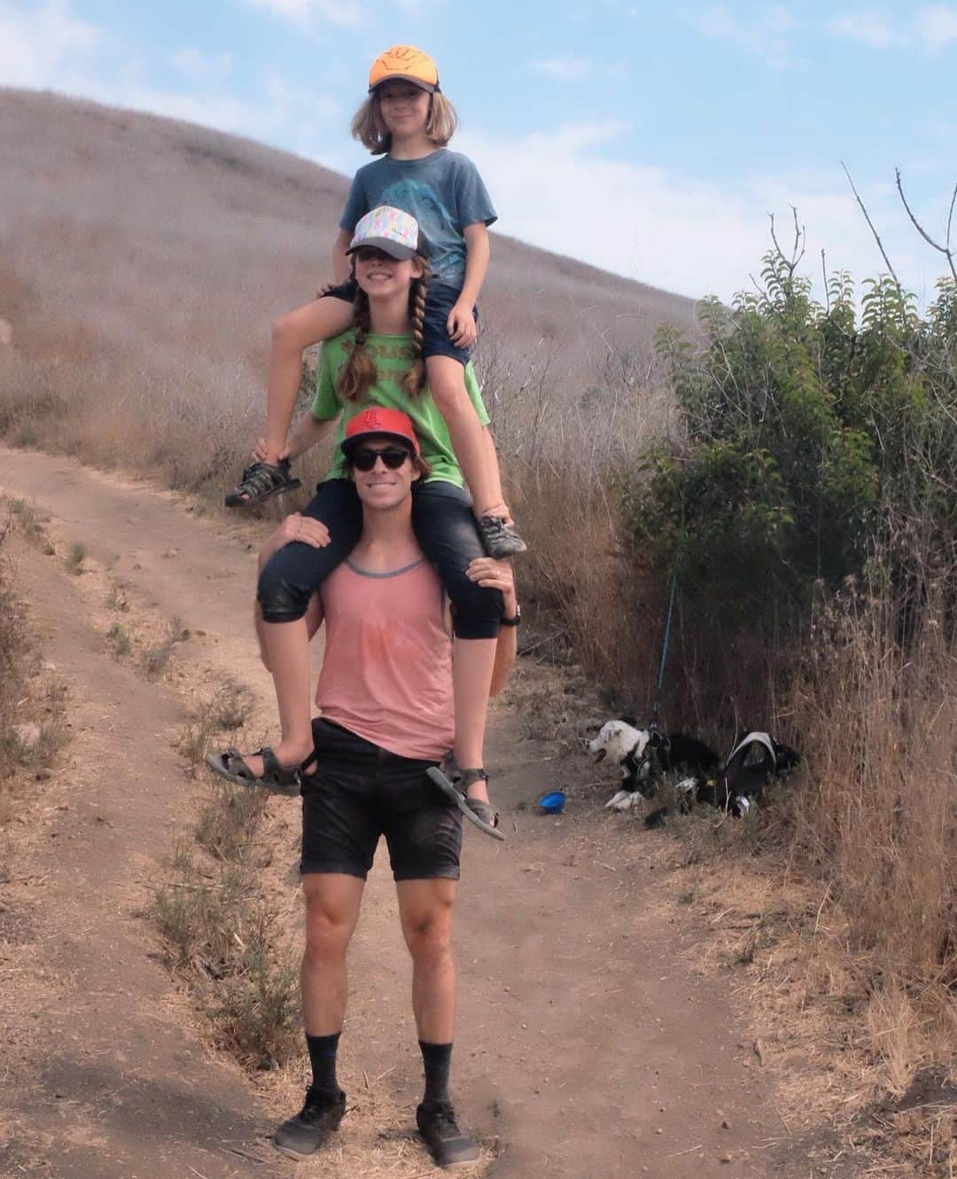 ライアン・ダニエル・ドブソンのインスタグラム：「A friend told me today that they “don’t believe in days anymore.”   ——   We’ve developed a tradition at the beginning of every school year where we go on a hike in Malibu and then have lunch at Malibu Seafood. Part of that tradition has been a father-child tower that is getting increasingly difficult to replicate as the kids grow.  Time is a strange thing these days, isn’t it? We have lost so many of the markers of its passage. Going into work. The regularity of school. The habituation of weekly practices. It’s like having a year where the seasons have been stripped away and, rather than the reset brought about by spring and then summer and then fall, it’s just one long winter. Which, living in Southern California with its endless summer, is arguably what we have. Warmer, but strangely frozen in time.   Usually, when reminders of time-passing happen, I don’t like them. They so easily force me to reconcile what I haven’t yet accomplished or what hasn’t changed that I wish would or how quickly the things I love are slipping away. But now, having lived through a COVID-initiated time-vacuum of sorts, I can see the health which temporal reminders offer. When I’m forced to realize how much my kids have grown by how hard it now is to do a double piggyback ride, I am also implicitly reminded how much I should treasure the hike and the lunch of fish and chips and the silly conversations that come later.  ——  You are changing and growing. The markers along the path might be harder to find, the pencil marks up the door frame might be more faint - but we are all still moving through the seasons. Believe in days. Celebrate them.」