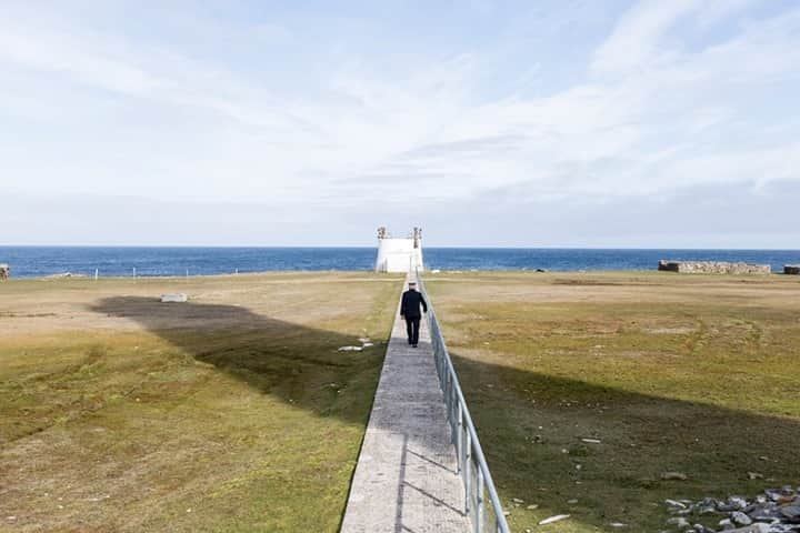 National Geographic Travelさんのインスタグラム写真 - (National Geographic TravelInstagram)「Photo by @robert_ormerod  Lighthouse keeper Billy Muir walks out to the old foghorn on the island of North Ronaldsay. The most northerly and most isolated of the Orkney Islands off the north coast of Scotland, North Ronaldsay is a great place to see migratory birds and its famous breed of seaweed-eating sheep.  The North Ronaldsay Lighthouse, not to be confused with the beacon at Dennis Head, is the oldest intact lighthouse in Scotland and has the last working foghorn in the country.」8月31日 17時08分 - natgeotravel