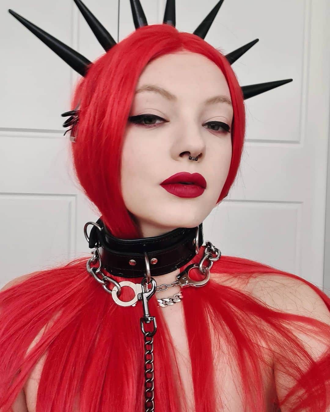 ティール・ココのインスタグラム：「Leave them on RED...🔥❤️😏 Throwing some lady liberty vibes in my @bitchfist_ chokers 🔥 check my last post for full look 🕸️ COMMENT your zodiac: I'm Pisces ♓ with Aires rising ♈」