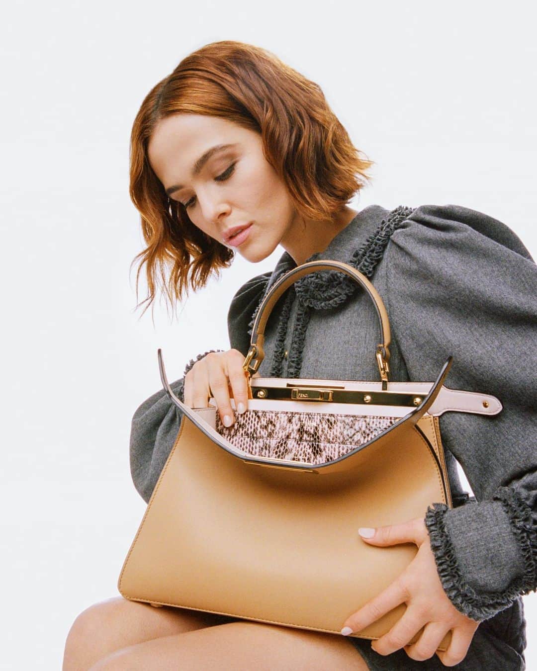 Fendiさんのインスタグラム写真 - (FendiInstagram)「From classic staples to charming new arrivals – discover the ever-perfect design and timeless, feminine appeal of our iconic #FendiPeekaboo bag, presented by @zoeydeutch in this season’s campaign. Tap the link in bio to explore and shop the edit at Fendi.com.  Director & Photographer: @andymadeleine_」8月31日 21時29分 - fendi