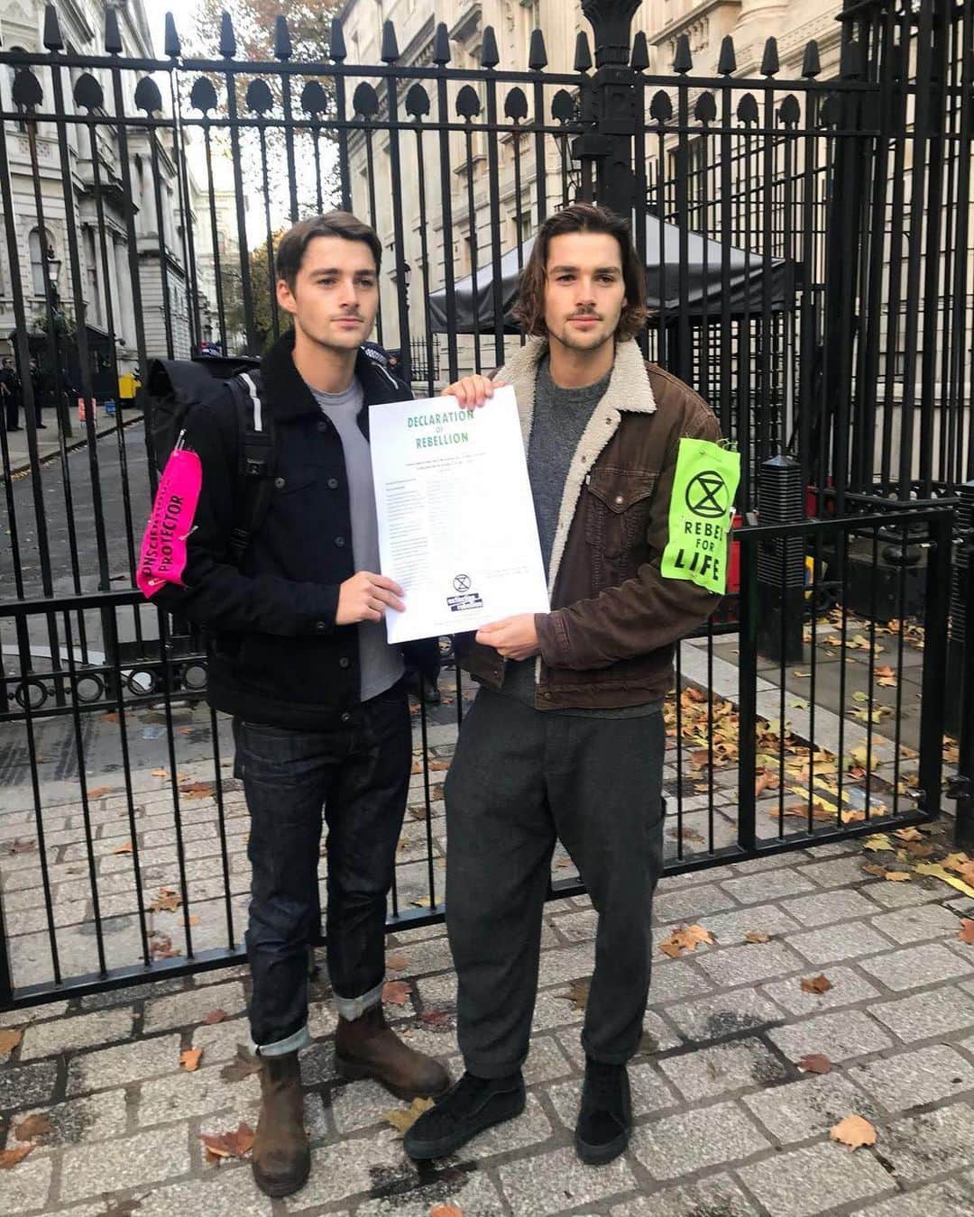 Jackson Harriesさんのインスタグラム写真 - (Jackson HarriesInstagram)「Tomorrow Extinction Rebellion will be back out on the streets. 🌍✊🏼 (At a safe social distance)   This photo was taken in November of 2018 and at this point @extinctionrebellion was just an idea - just words on a page - dreamt up by an ambitious group of activists. In fact, they were so desperate for help that the most high profile people they could find to deliver the ‘Declaration of Rebellion’ to Downing street was... us.🤪 I’ll never forget that day. It was cold and grey and we stood outside  reading the declaration to an audience of five people. It felt underwhelming to say the least…  Little did we know that @extinctionrebellion would soon become an extraordinary social movement, pushing the UK government to make history in declaring ‘A Climate and Ecological emergency’. Since then XR have carried out multiple actions bringing London to a stand-still and inspiring splinter groups in over 75 countries across the world.  Of course, that’s not to say the movement is perfect. As with any decentralised movement, it has suffered at the hands a few individuals misjudged and misguided actions, and has consistently been criticised for it’s focus on arrest and its failing to include black and minority voices. These criticisms need to be taken seriously, and there is a lot of work to be done.  As the COVID-19 pandemic has swept across the world, the movement faces perhaps its greatest challenge yet. Understandably climate change has taken a back seat in current affairs and mass gatherings feel like a thing of the past. At the same time, it has never been more important to come together in protest against the broken system that has led us to this point.   With that in mind tomorrow Extinction Rebellion prepares to take to the streets again, this time to pressure Government to back a new Climate and Ecological Bill. Climate change, COVID-19 and racial injustice are all symptoms of a toxic system that is driving us to extinction. We will be marching in to highlight the intersection of these global crises.   To find out more follow @extinctionrebellion on twitter and I’ll be covering the events via my stories and on @earthrise.studio.」9月1日 4時22分 - jackharries
