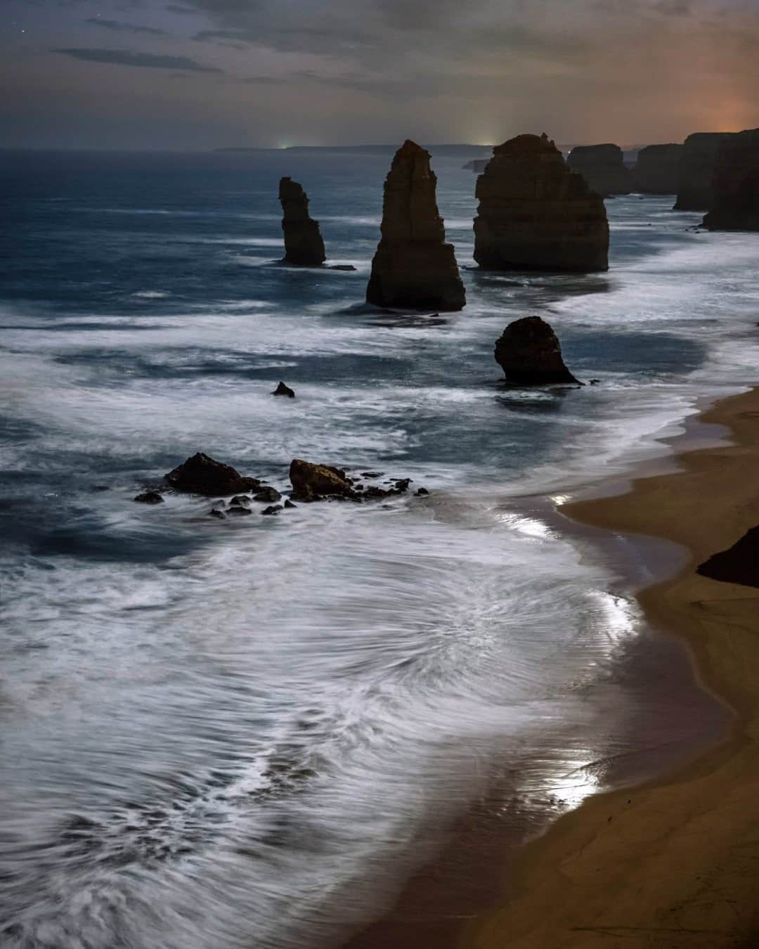 National Geographic Travelさんのインスタグラム写真 - (National Geographic TravelInstagram)「Photo by @babaktafreshi  A moonlit night on the southern shore of Australia. The Twelve Apostles rocks on the Great Ocean Road of Victoria reveal mysterious faces at dark. Explore more of our world's wonders at night with me @babaktafreshi. #nightphotography #australia #greatoceanroad #12apostles」9月1日 9時04分 - natgeotravel