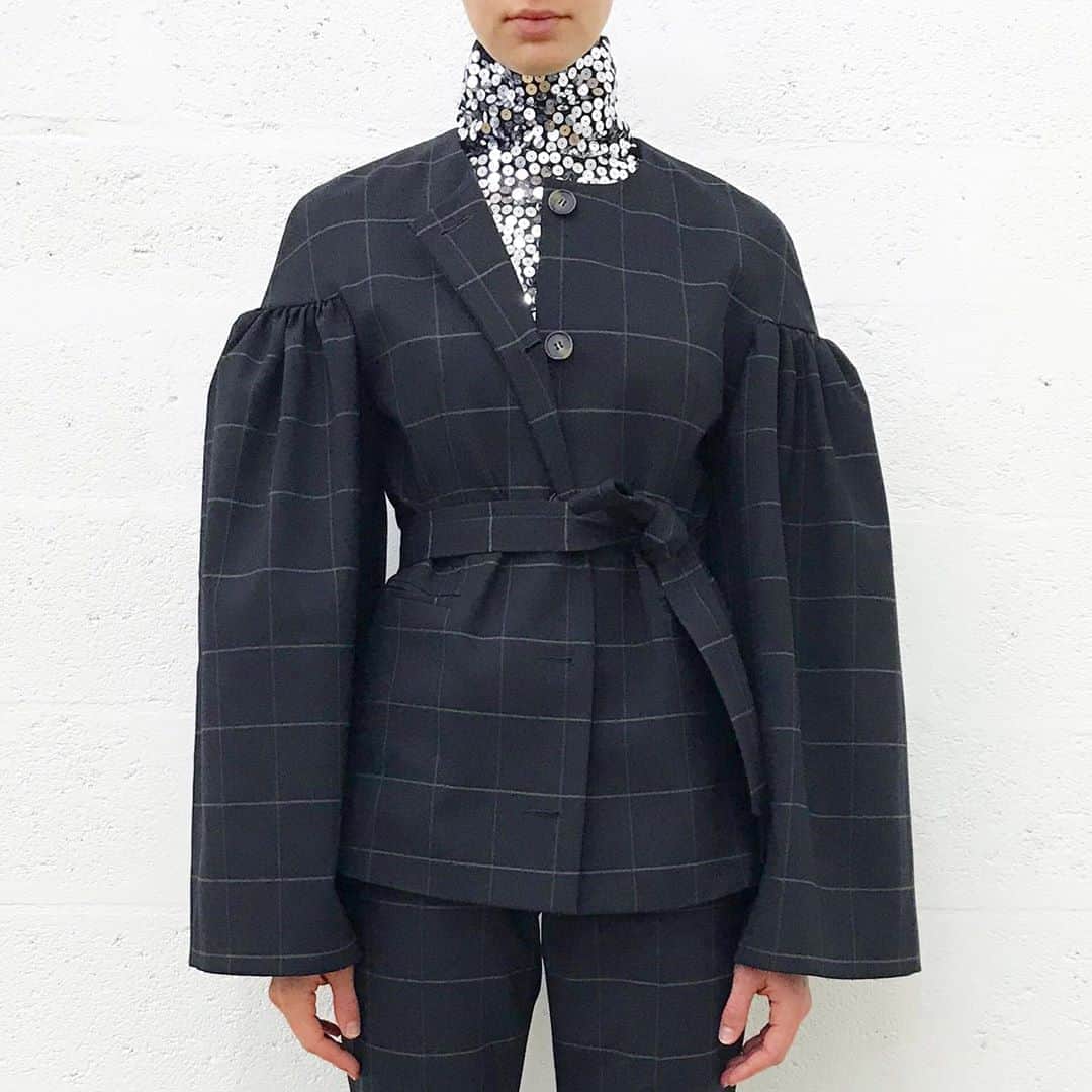 のインスタグラム：「Inspired by both 50s couture shapes and Men’s tailoring , the Cloud Jacket is cut in a traditional checked Virgin Wool and worn with matching skinny pants and a T shirt in Jersey with a sequinned high collar... it’s one of those favourite looks of the last few seasons that were put together for the last Fall Collection.. I never liked ‘total looks’ but lately the idea of a 2 piece suit seems really appealing- as long as it’s surprising and kinda interesting 😇 #fallfashion #favouritelooks #styleinspiration #tailoring #couture #mensfashion #sequins #tshirtdesign #tshirt」