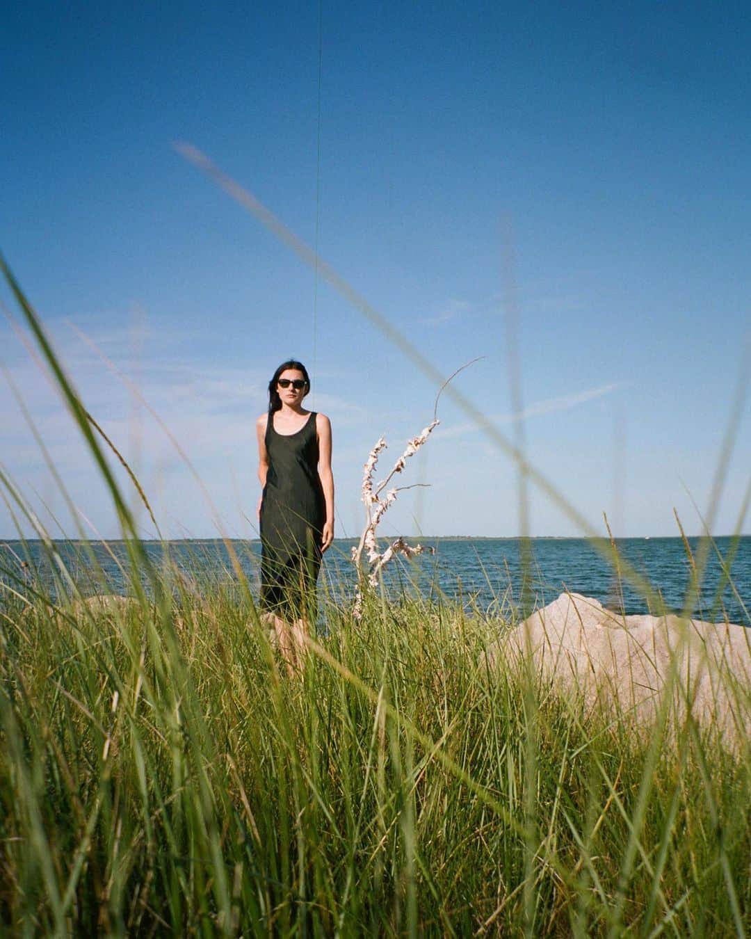 のインスタグラム：「Love that feeling of the warm sunlight from the last days of summer mixing with the cool wind from the first days of fall.  Anji Dress in Black.  #jporganic #organicbyjohnpatrick #slipdress #lbd #littleblackdress #tankdress #springsny #thehamptons #lastdaysofsummer」