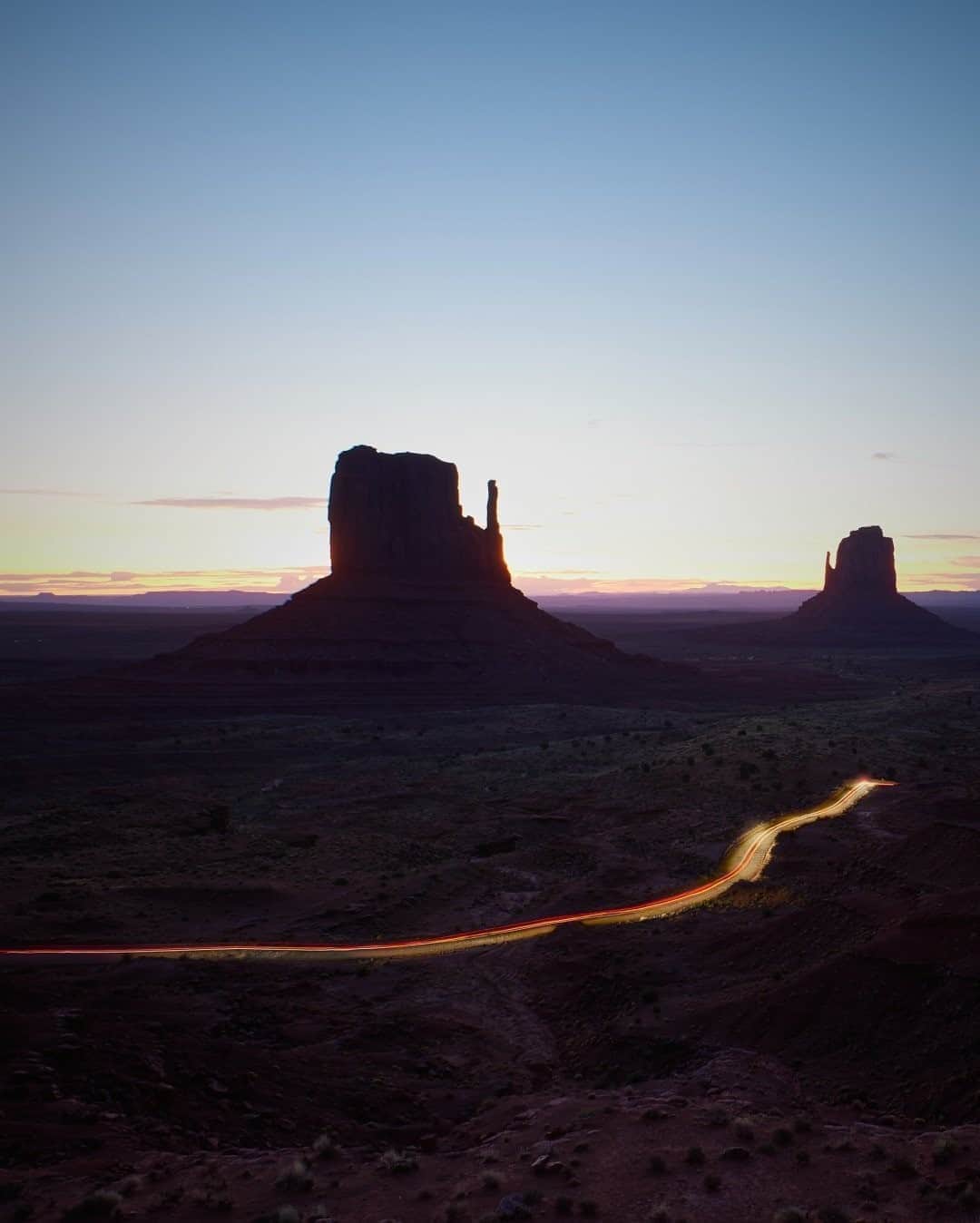 National Geographic Travelさんのインスタグラム写真 - (National Geographic TravelInstagram)「Photo by @juancosoriophotography  The sky glows over Monument Valley, Arizona, and the land reflects purple, orange, and yellow hues that progress slowly, revealing the magnificence of the Navajo Nation. This unforgettable experience inspired awe and is worth repeating many times. The traffic is very light, but when present it allows for long-exposure images that paint the curved road along this iconic location. Composition made from 26 images taken in sequence. Congratulations to Juan Carlos Osorio on becoming the August Your Shot Photographer of the Month! @natgeoyourshot #YourShotPhotographer #MonumentValley #NavajoNation #longexposure #nightphotography」9月4日 4時06分 - natgeotravel