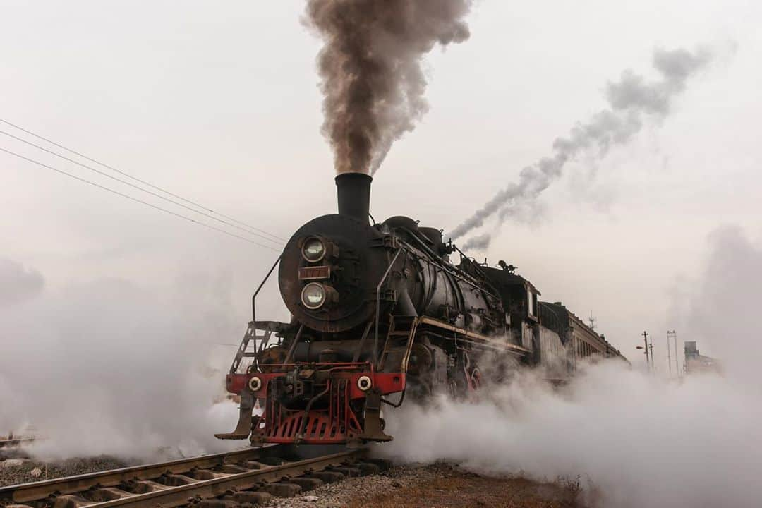 Michael Yamashitaさんのインスタグラム写真 - (Michael YamashitaInstagram)「China simultaneously operates the world’s first automated high-speed rail system and the world’s last revenue steam railroad. In 2012, I photographed both for National Geographic, for my story titled "China Rails." The world's fastest train at the time was the China Railway 380 AL bullet train capable of speeds up to 290 miles/hr. with its sleek, sword-like shape. At the same time, in the far northern province of Liaoning where coal still powers the local economy, steam engines built in the 1980s were laboring to pull coal trains out of mines dug into the arid landscape. Today, China operates 66% of the world’s high-speed network (with 22,000 route miles) and is still expanding.  And though steam-powered engines are no longer used for passenger travel, Train magazine reports that there is one remaining bastion of revenue steam operations in China (and the world) -- in the Gobi Desert, where engines belching black smoke haul coal from the pit mines of Sandaoling in Xinjiang province . But steam engine enthusiasts better get there fast as rumor has it that the mines will be shut down by the end of this year, and the locomotives are to be retired to museums, vestiges of a China that is disappearing at a high-speed pace. #chinarailway #chinasteam #highspeedtrains #steamtrain」9月3日 20時42分 - yamashitaphoto