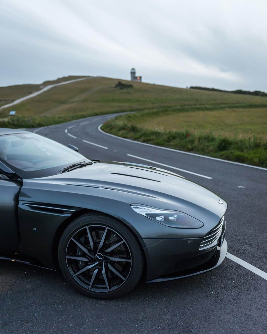 Karan B.のインスタグラム：「@aaronbhall has been posting Aston Martin shots from my city all day. It just feels good to know I shot the DB-11 while Aaron was still wearing diapers and that I am his inspo for everything in life.  Oh, and here’s a shot of some grass.」