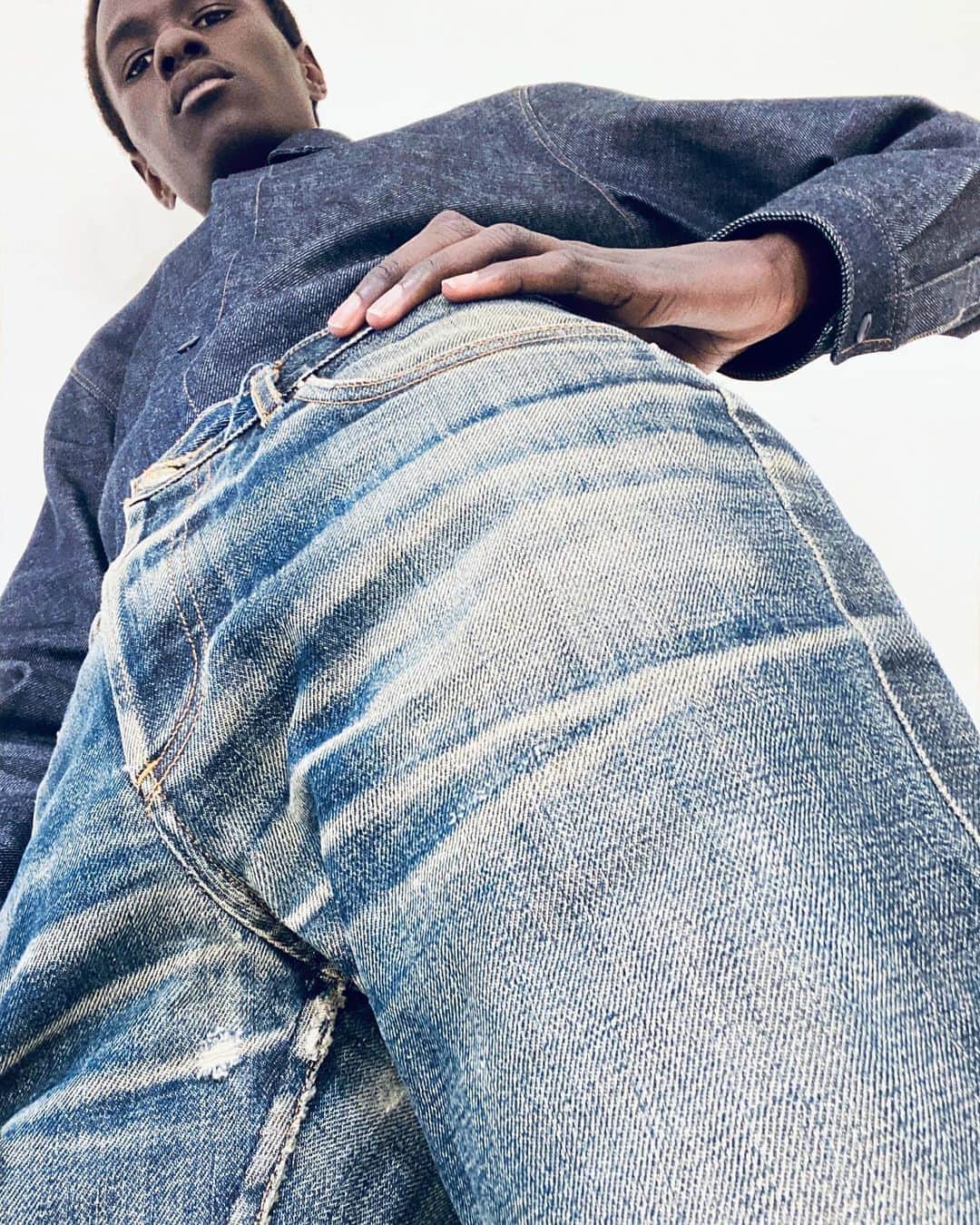 アーペーセーのインスタグラム：「A.P.C. Butler⠀ ⠀ For the first time, A.P.C. gathered together the entire European stock of Butler jeans. ⠀ From the 5th to the 20th September 2020, they will be exclusively available at the Filles du Calvaire store in Paris. ⠀ ⠀ Image from our new A.P.C. denim campaign, shot at the A.P.C. headquarters by @suzannekoller  ⠀ Creative direction and styling : Suzanne Koller⠀ ⠀ @malickbodi is wearing the Butler jeans with a denim shirt specially made for the shoot. ⠀ ⠀ #APC #APCDenim #APCbutler #Paris」