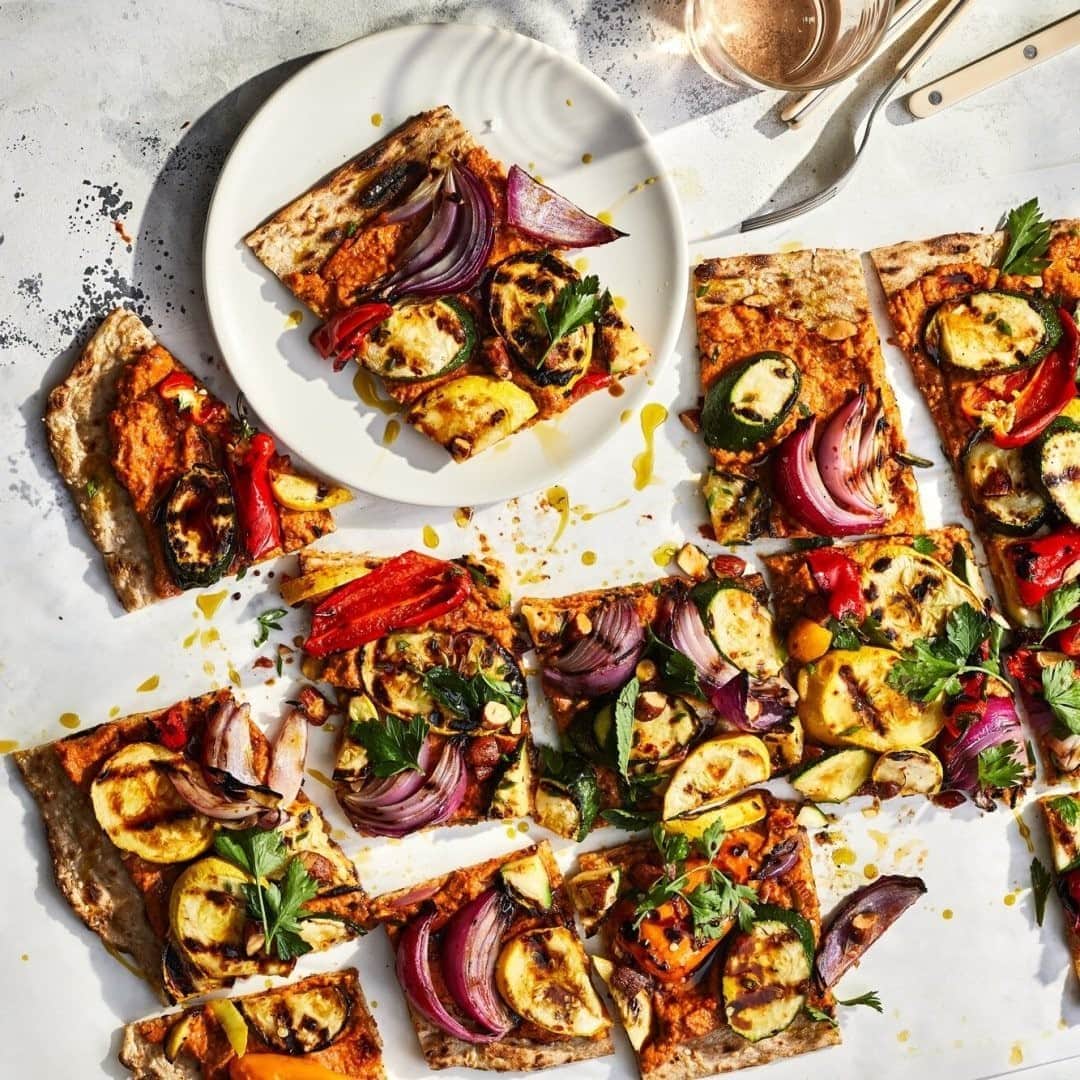 Food & Wineさんのインスタグラム写真 - (Food & WineInstagram)「For many, grilling is all about the meat—but there's no reason why vegetarians should have to be content with coleslaw at the barbecue. This giant grilled vegetable flatbread with smoky almond muhammara—an "edible yard of vegetable goodness," as our food editor @jbrothersmiller called it—was a showstopper from our June issue, but we think it's perfect for your Labor Day weekend as well. Hit the farmer's market this morning for your favorite late-summer vegetables, then fire up the grill and get to work. Tap the link in our bio for the recipe! 📸: @protazio」9月6日 0時00分 - foodandwine