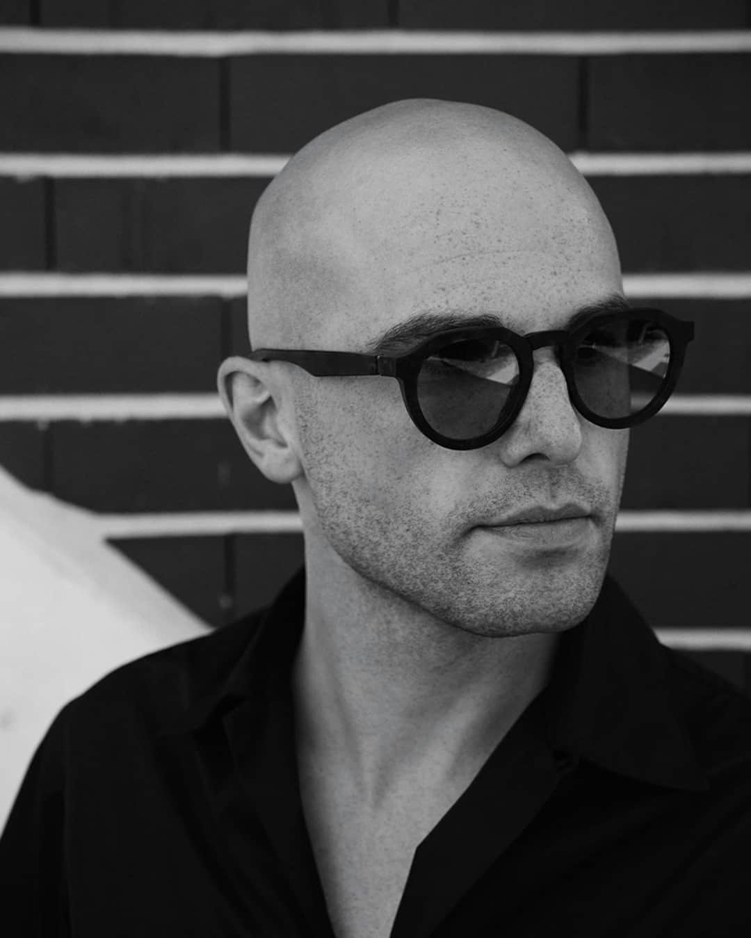 のインスタグラム：「The RAW – bold shapes in unpolished acetate for a sculptural aesthetic; @felipe.palma wears MMRAW007 in Raw Black with  Dark Grey Solid lenses at the new MYKITA Shop Munich. __ #mykita #mykitamaisonmargiela #maisonmargiela」