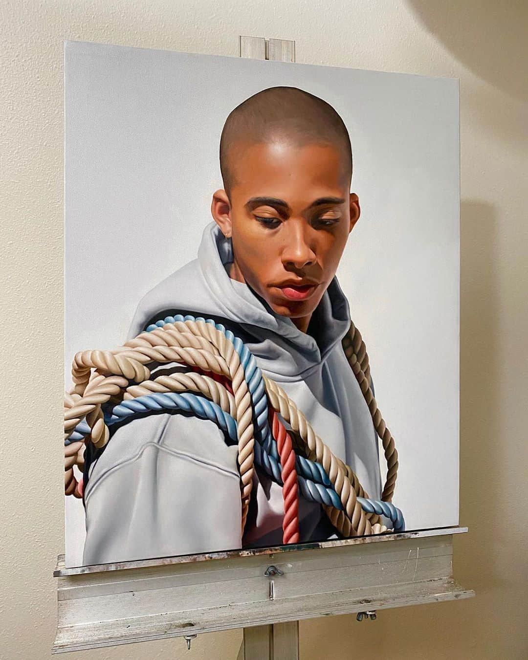 Instagramさんのインスタグラム写真 - (InstagramInstagram)「“I am passionate about living my life on my terms and creating art that inspires positive change,” says Los Angeles-based Delfin Finley (@delfin). The artist paints hyper-realistic representational portraits of his peers that symbolize the Black experience and address issues of systemic oppression and racial injustice.⁣ ⁣ “At this point in my journey, my art celebrates painting people of color in ways that were missing from museums and galleries when I was growing up. I paint to highlight the beauty and strength of each subject, capturing images that give the viewer a perspective of the challenges of living in America.⁣ ⁣ My work honors the pain, struggle and bravery Black people have experienced to overcome the violence and brutality of our past. It focuses on how that history still affects us and how we carry it with us, whether we want to or not. The weight of our past cannot be shaken off or set aside.⁣ ⁣ There is tremendous empowerment in sharing our stories and stepping out from the shadows of being a voiceless victim. Only through awareness of all the issues, can we see the disparity of how different our life experiences are and then move towards equality.”⁣ ⁣ #ShareBlackStories⁣ ⁣ Photo by @delfin」9月6日 1時47分 - instagram