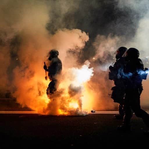 のインスタグラム：「AFP Photo 📷 Allison Dinner - Oregon Police wearing anti-riot gear march towards protesters through tear gas smoke during the 100th day and night of protests against racism and police brutality in Portland, Oregon, on September 5, 2020. Police arrested dozens of people and used tear gas against hundreds of demonstrators in Portland late on September 5 as the western US city marked 100 days since Black Lives Matter protests erupted against racism and police brutality. Protests in major US cities erupted after the death of African American George Floyd in May 2020 at the hands of a white police officer in Minneapolis.」