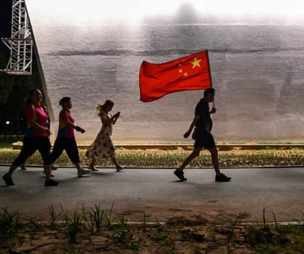 のインスタグラム：「AFP Photo 📷 @hectorretamalphotographer -  In this photo taken on September 4, 2020, a man walks with the Chinese national flag in a park next to the Yangtze River in Wuhan, China's central Hubei province. China is recasting Wuhan as a heroic coronavirus victim and trying to throw doubt on the pandemic's origin story as it aims to seize the narrative at a time of growing global distrust of Beijing.」