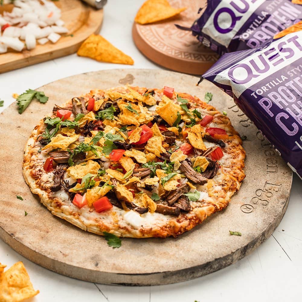 questnutritionさんのインスタグラム写真 - (questnutritionInstagram)「Who wants a Questified Taco Pizza! 🌮🍕💪 Loaded Taco Chips, tomatoes, onions, shredded beef, cilantro, & shredded cheese used as toppings if you were wondering. 🤤 • 👉 GET FULL RECIPE ➡️ LINK (tap.bio) IN BIO (swipe left from 1st card to 2nd card) 👈 • Per serving: 20g protein, 9g carb, 12g fat. (5g net carbs) #OnaQuest #Questify #QuestNutrition #questpizza #tacotuesday」10月6日 3時32分 - questnutrition