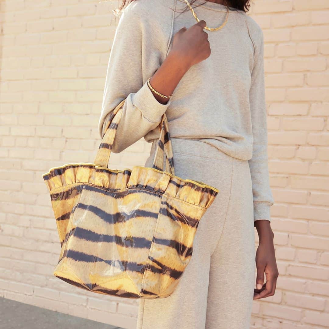 レフラーランドールのインスタグラム：「Our favorite ruffled tote, Claire, is new in this season in water resistant tiger print nylon.」