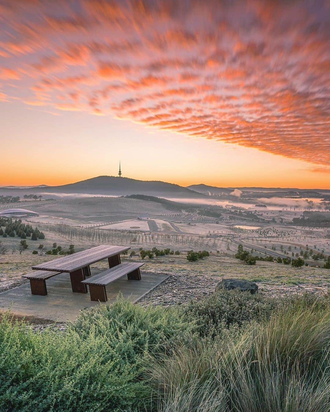 Australiaさんのインスタグラム写真 - (AustraliaInstagram)「We’ve saved you the best seat in the house 👌 @dean.ohlmus braved a chilly @visitcanberra morning to capture this glorious view at #sunrise, taken from the @nationalarboretumcanberra. This particular spot is home to 250 hectares of forests and gardens, full of rare and endangered trees from #Australia and around the world! A popular retreat for locals looking to relax and unwind, the #Arboretum is only a 10-minute drive from the city centre making it a great place to add to your future #Canberra itinerary. #seeaustralia #visitcanberra」9月12日 20時00分 - australia