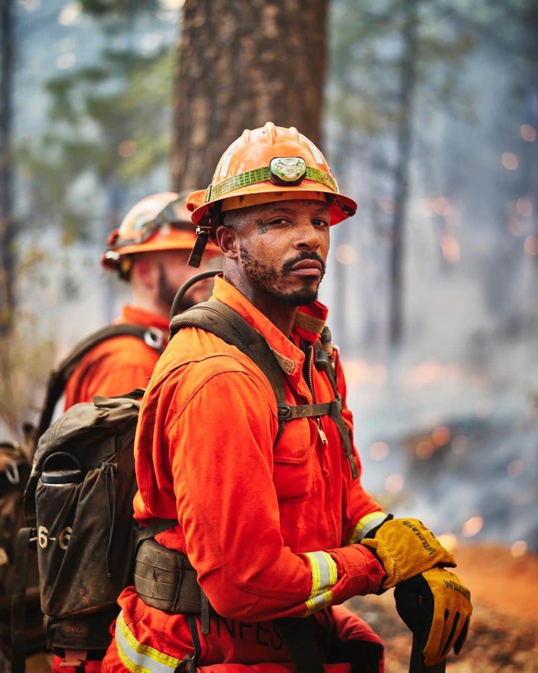 National Geographic Creativeさんのインスタグラム写真 - (National Geographic CreativeInstagram)「Photos by @stuartpalley / A portrait of Dwayne Bullette, a 2 year member of the Valley View inmate fire crew, at the Bear Fire near Berry Creek, CA on Friday September 11th. The crew was “holding” a firing operation, watching for embers blowing over the fireline where Cal Fire crews were protecting a historic fire lookout tower and critical communications infrastructure, such as radio and cell communication towers. A firing operation is designed to deprive the main body of fire fuel when it reaches a certain point. It is a defensive wildland firefighting tactic and works to protect the buildings at risk. Some of the Cal Fire crew members were on their first week of fire, being brought on as a late season hire to augment staffing for hand crews.   To the east was the town of Berry Creek, virtually destroyed by the blaze during the past week’s severe wind event. Multiple fatality victims were found in the area, and pine trees exhibited signs of “flash freezing” where the needles are frozen by heat in the direction of the fire and wind. It looked like a bomb went off. #BearFire #NorthComplex #CAFire #CalFire」9月13日 7時00分 - natgeointhefield